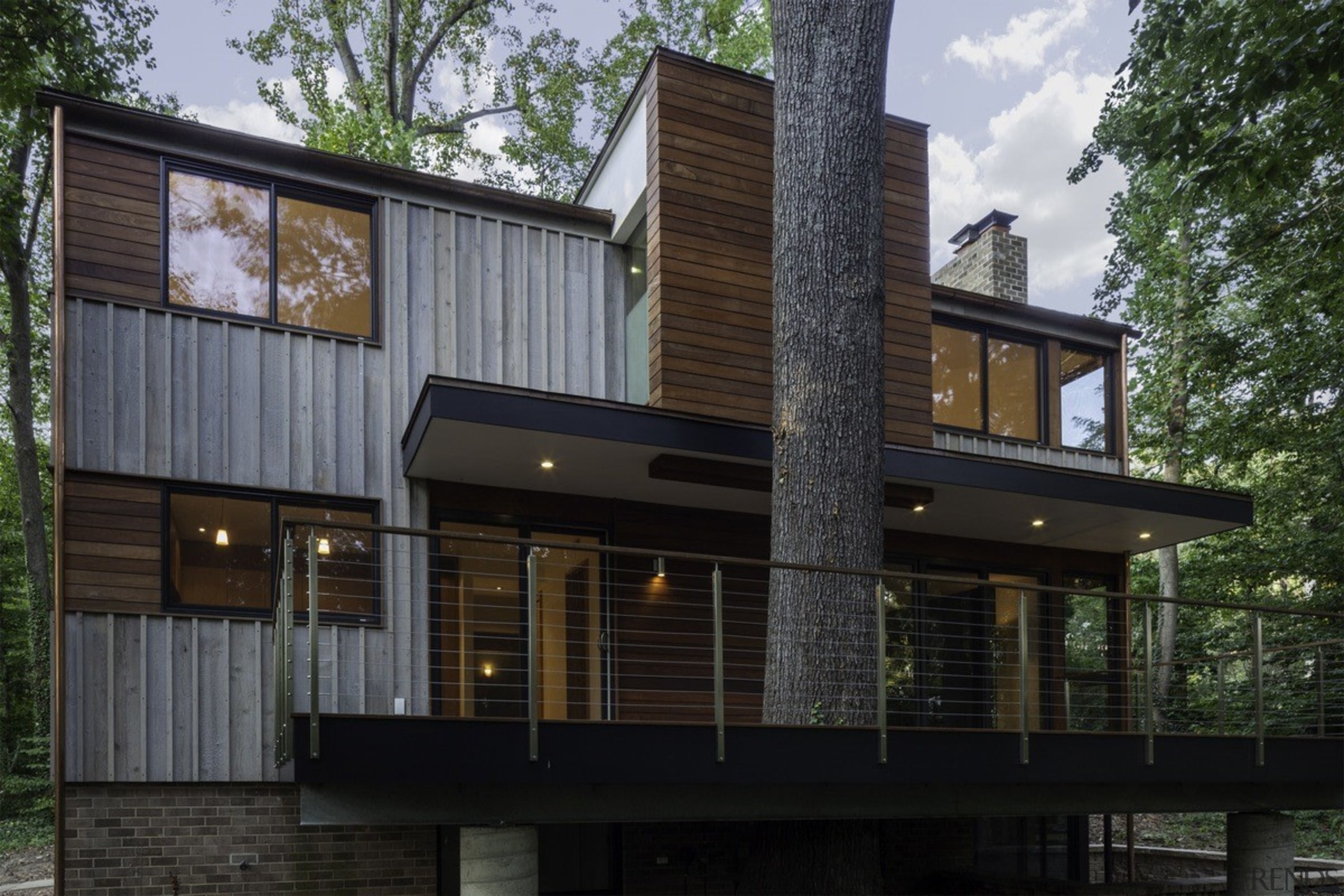 The deck wraps around this tree - The architecture, building, elevation, facade, home, house, property, real estate, residential area, siding, black, gray