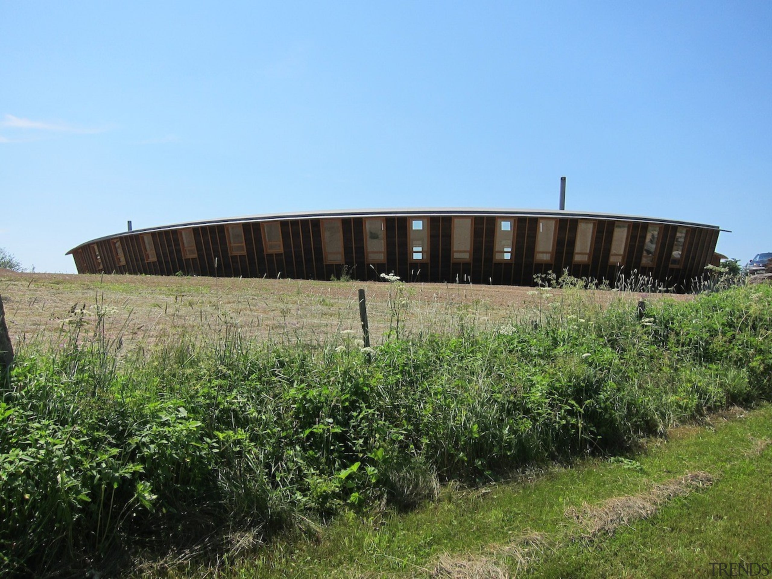 With sustainability and passive design rising high in grass, plant, sky, structure, tree, teal