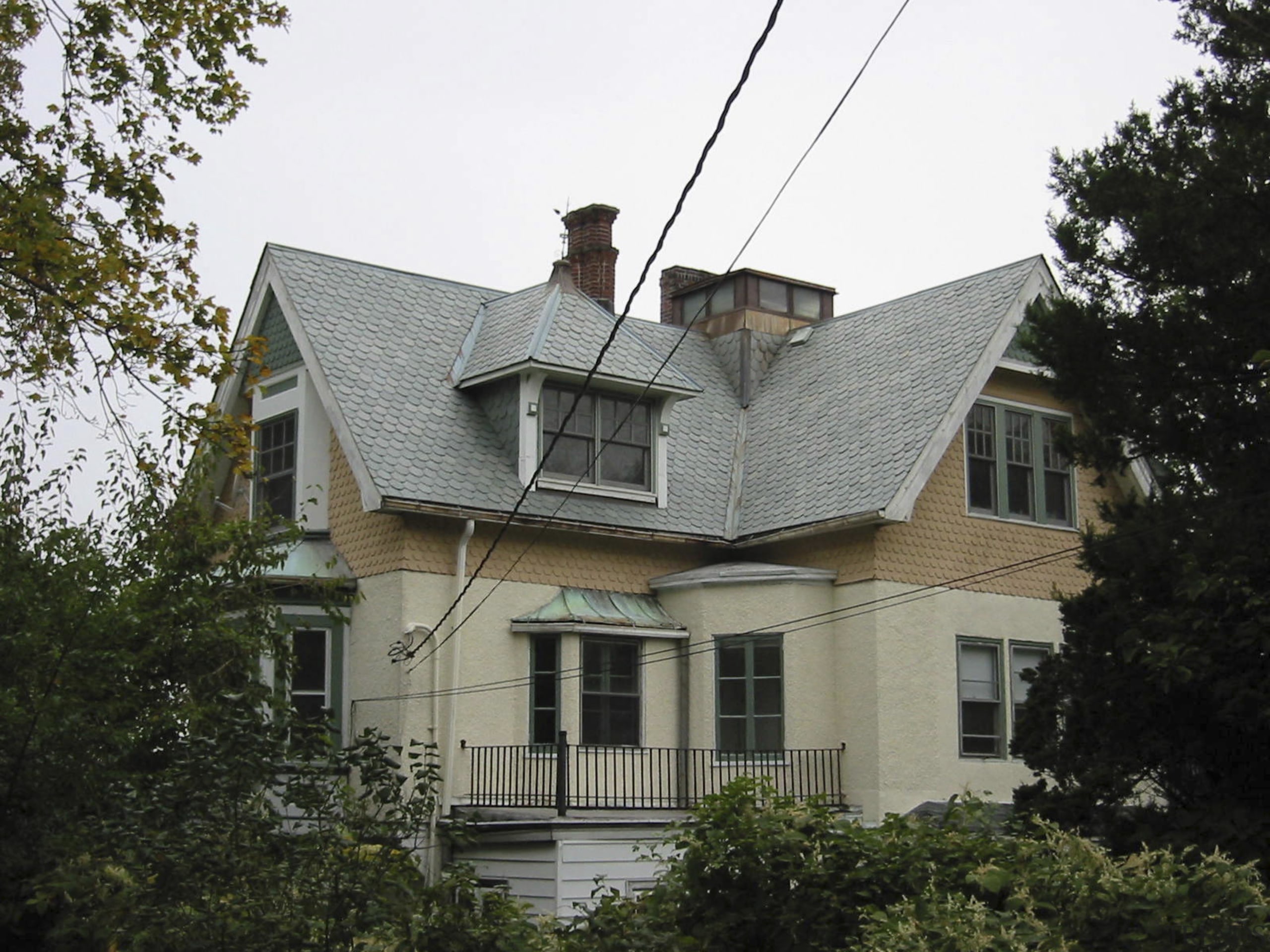 An exterior view of the home before it architecture, building, estate, facade, home, house, mansion, neighbourhood, outdoor structure, property, real estate, residential area, roof, siding, suburb, window, gray