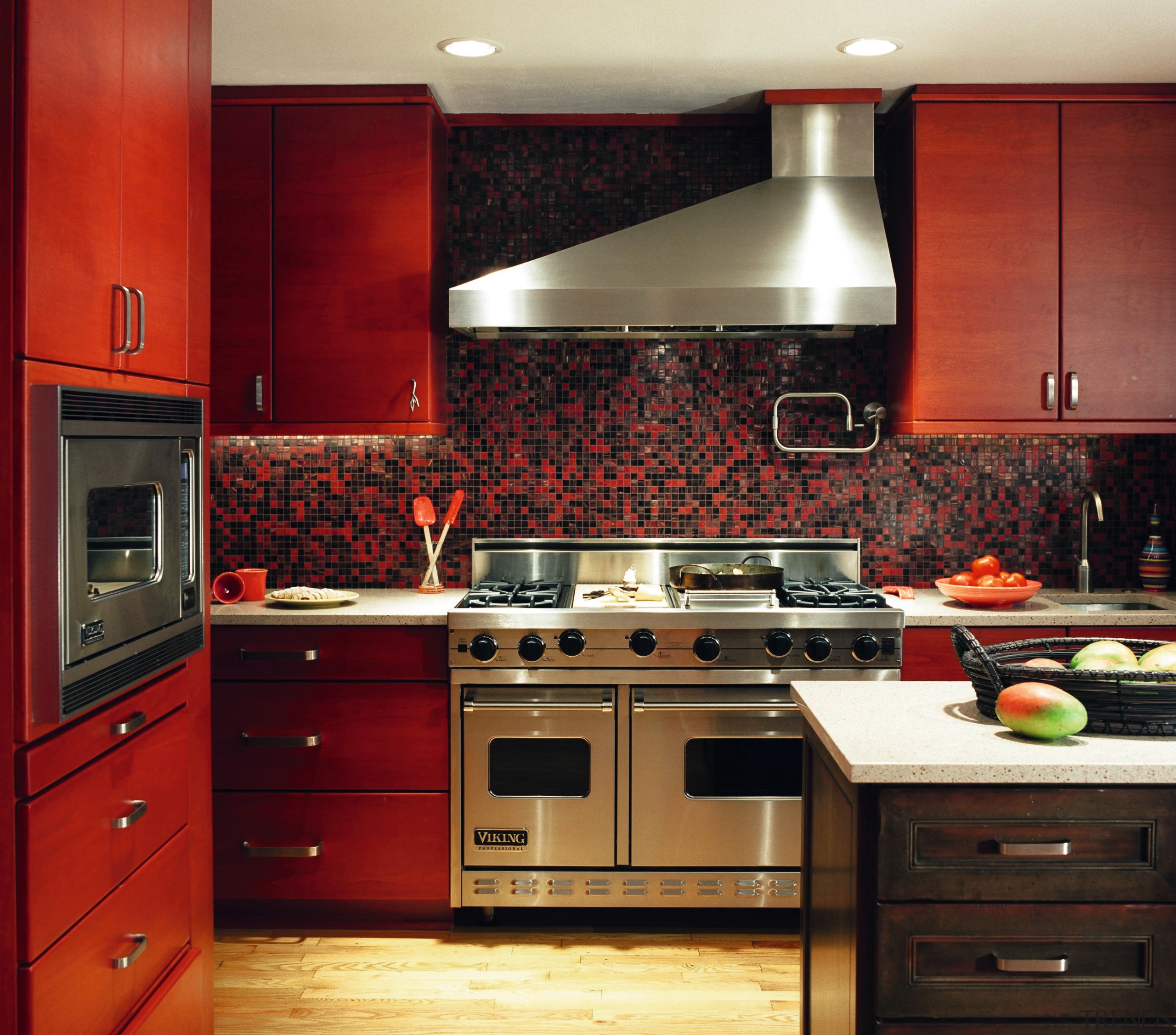 A view of frameless cabinets in alder, with cabinetry, countertop, flooring, interior design, kitchen, kitchen stove, room, under cabinet lighting, red, black