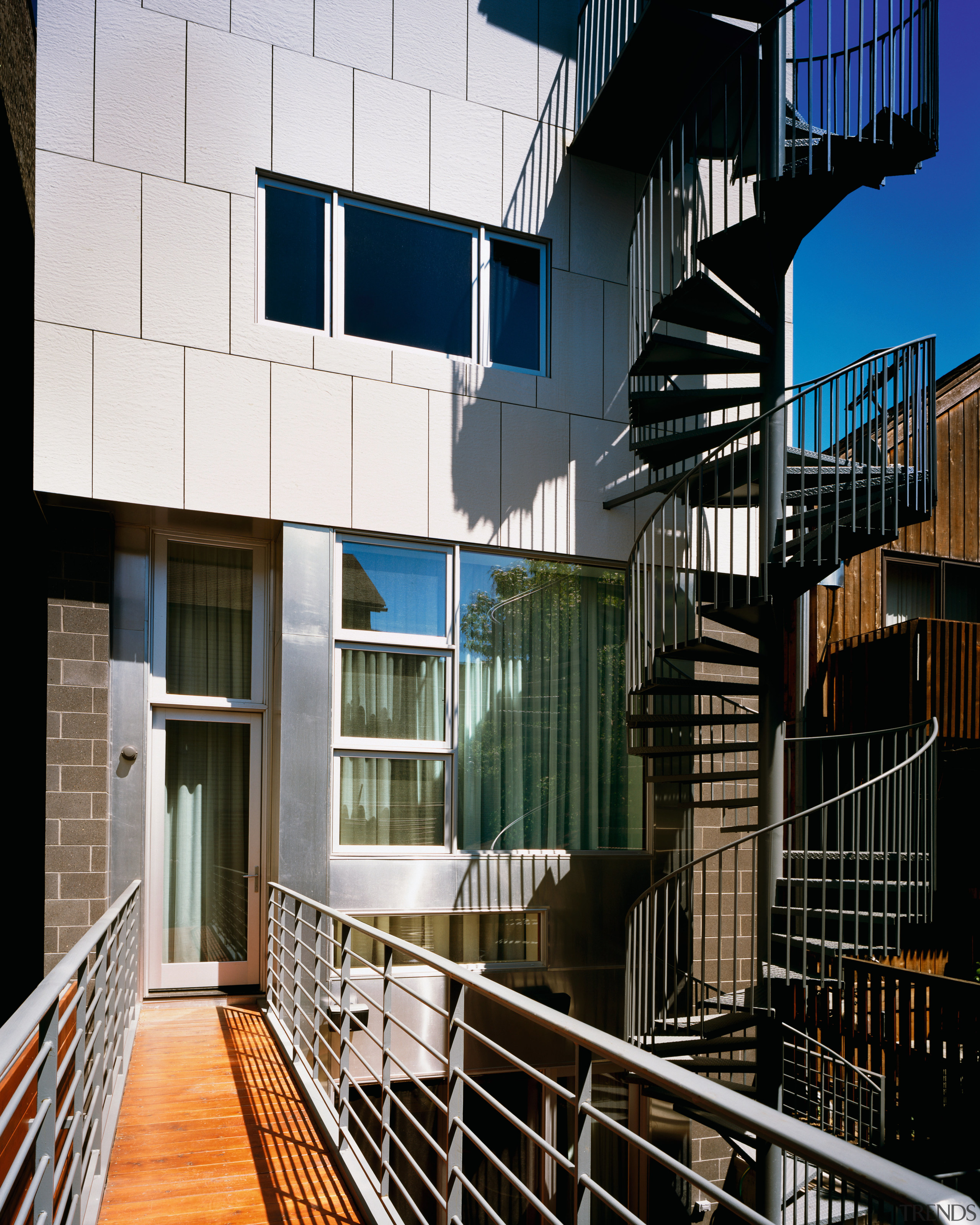 Exterior view of the spiral stairway. - Exterior apartment, architecture, balcony, building, condominium, facade, handrail, house, real estate, residential area, window, black, white