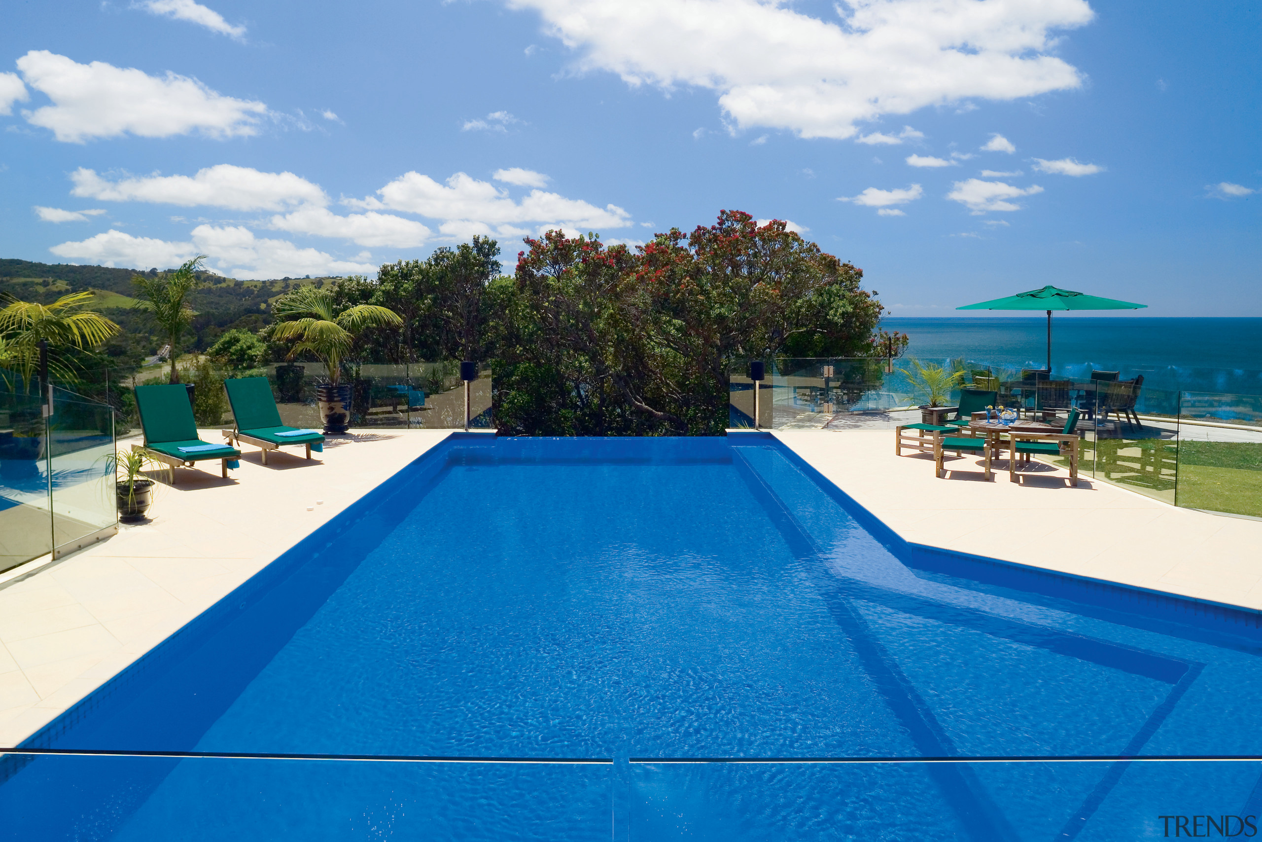 View of this Deep blue pool designed and bay, caribbean, estate, leisure, property, real estate, resort, resort town, sky, swimming pool, tourism, vacation, water, blue, teal