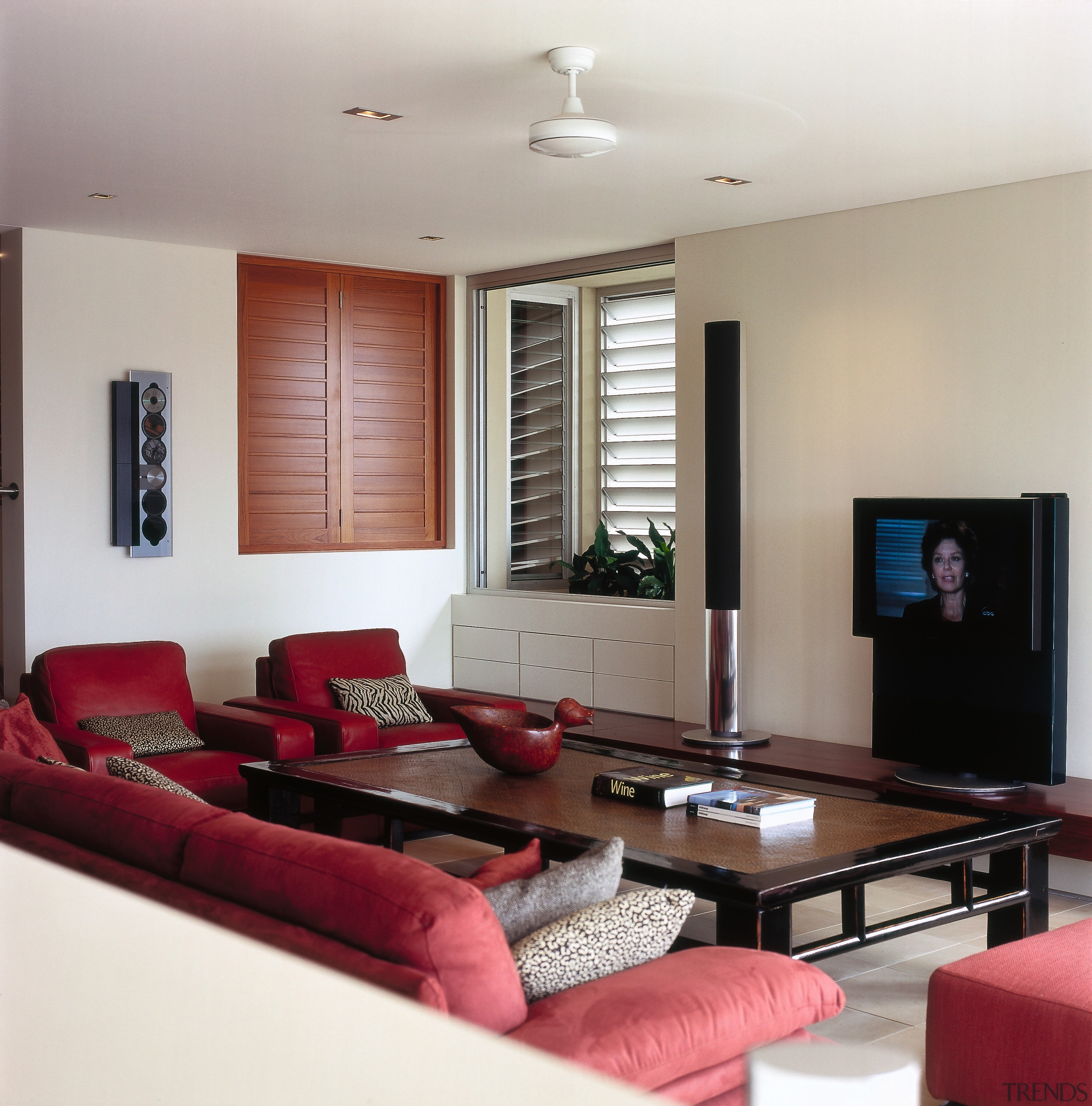 A view of the lounge area with the ceiling, floor, furniture, home, interior design, living room, property, real estate, room, table, gray, red