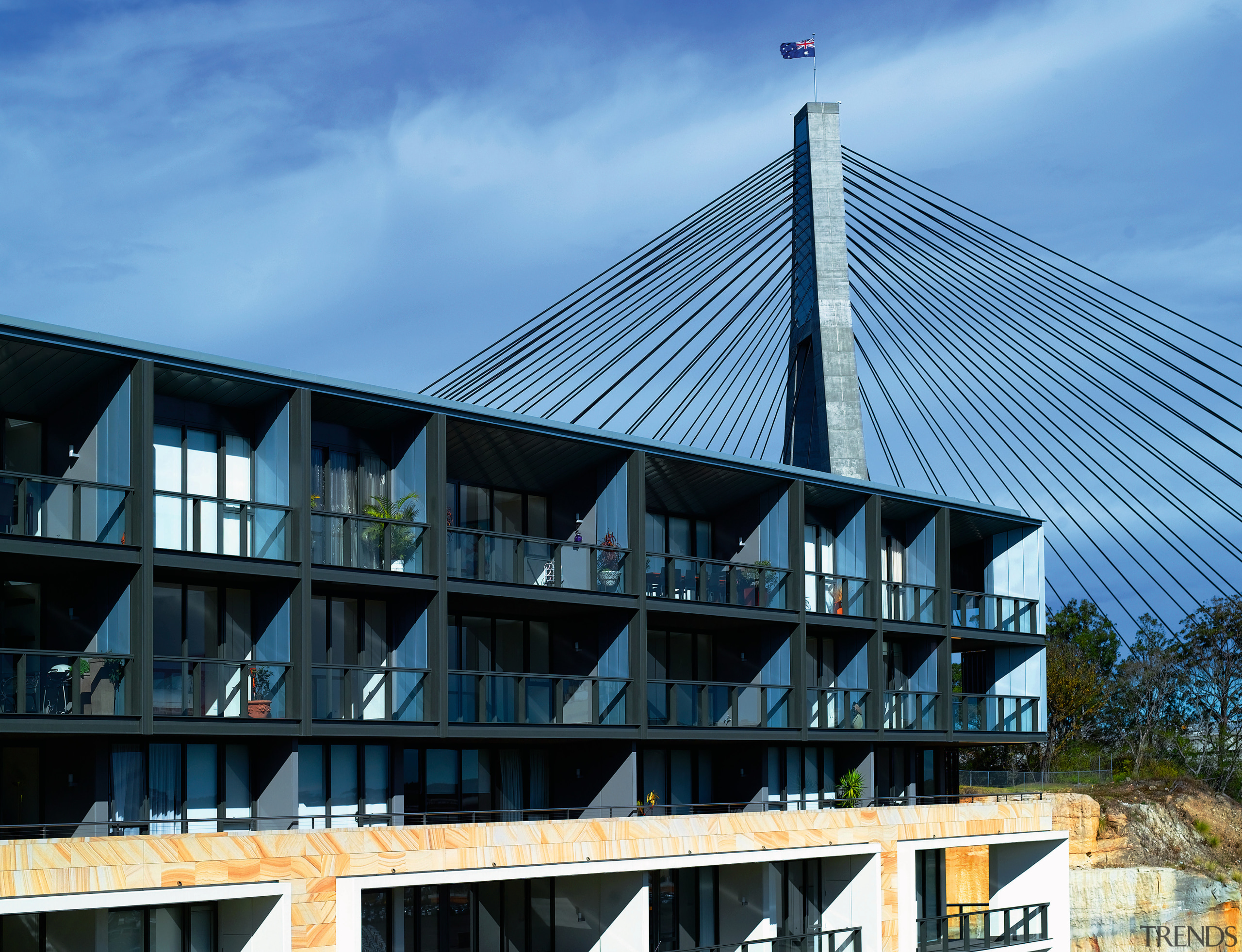 Exterior view of apartment building showing metal titanium architecture, building, condominium, corporate headquarters, facade, house, real estate, roof, sky, structure, teal, black