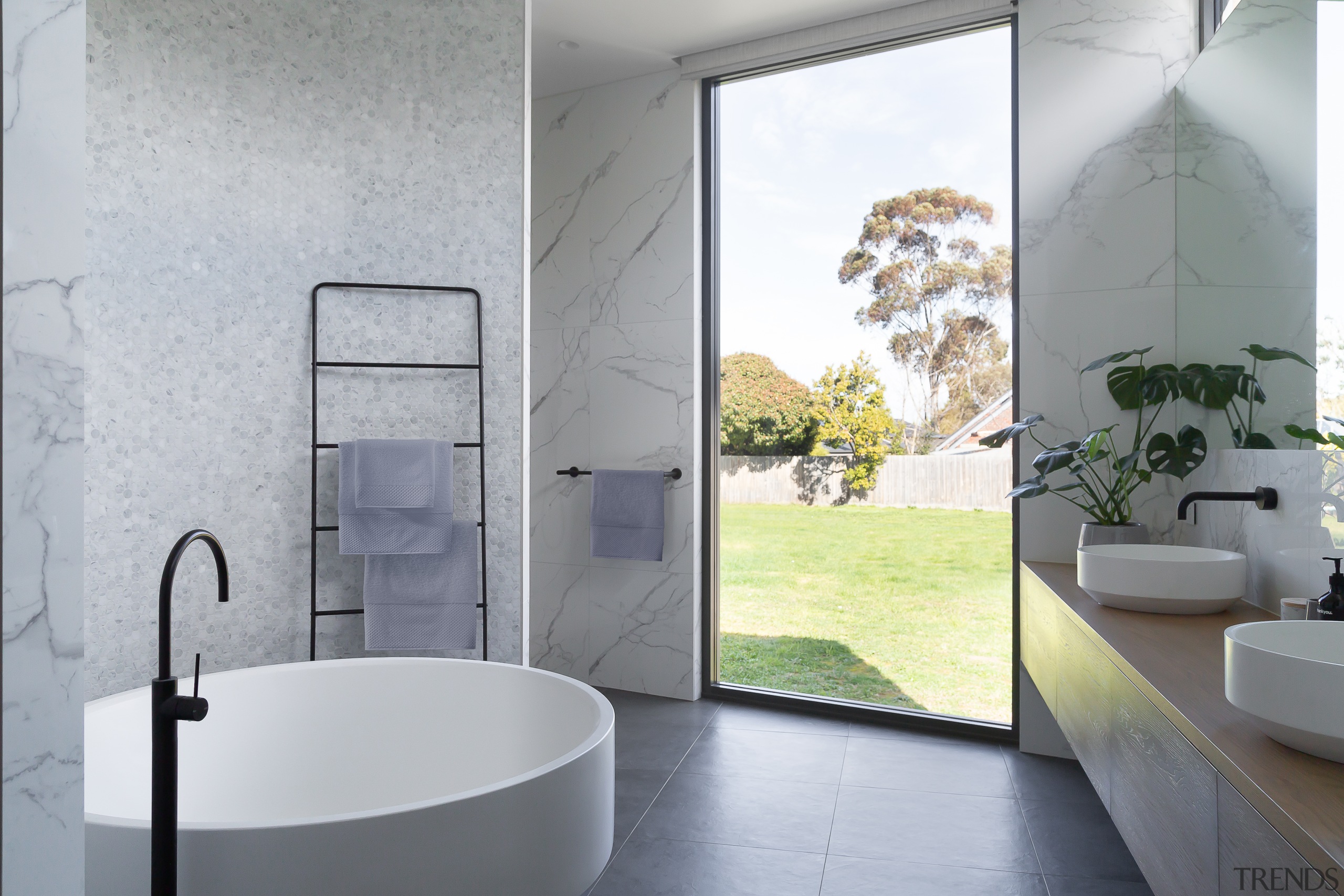 ​​​​​​​This new master bathroom in a rebuilt and gray