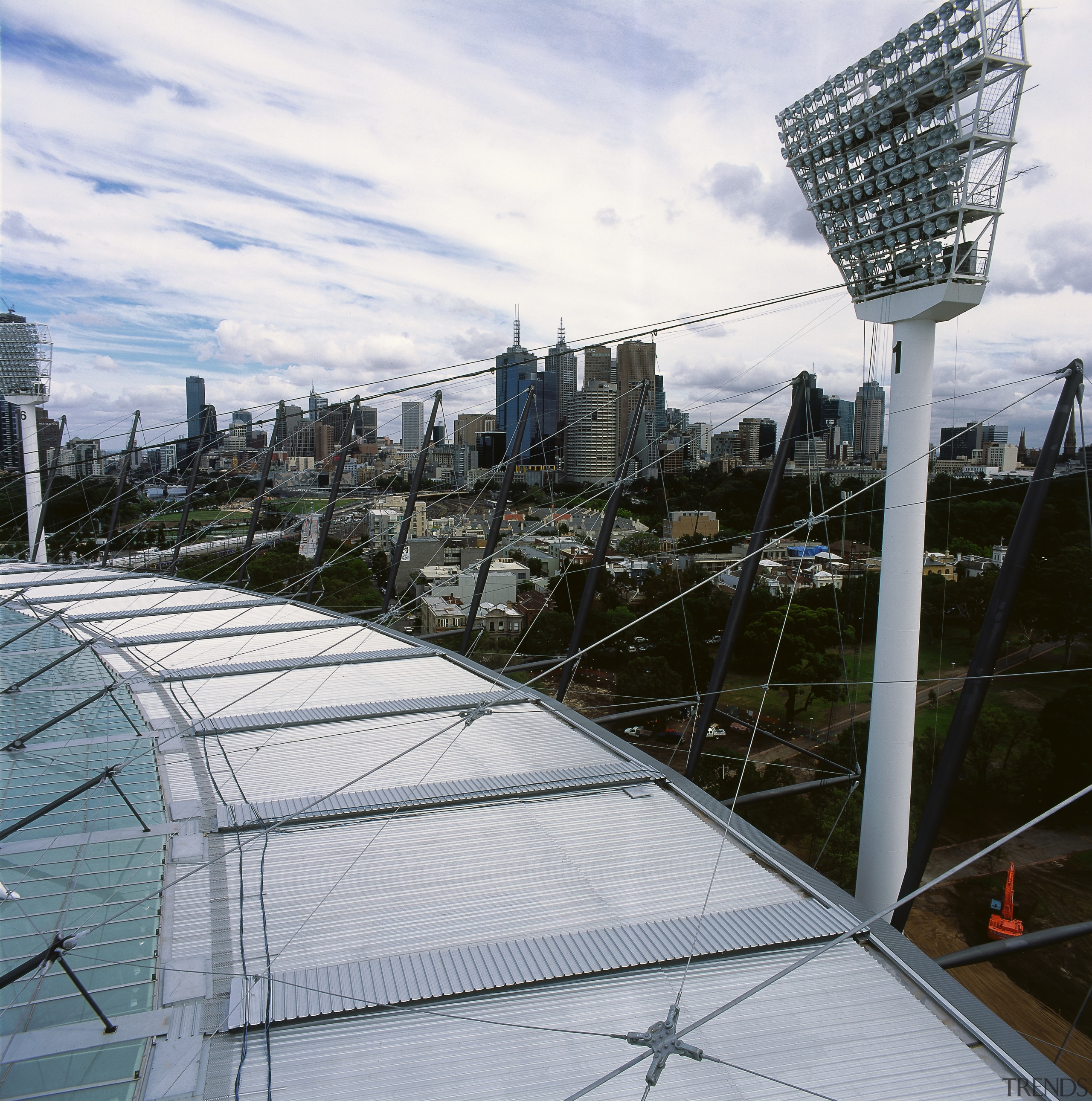 View of stadium roofing showing panels and cabling. architecture, building, city, condominium, metropolitan area, roof, sky, skyscraper, structure, urban area, gray, black