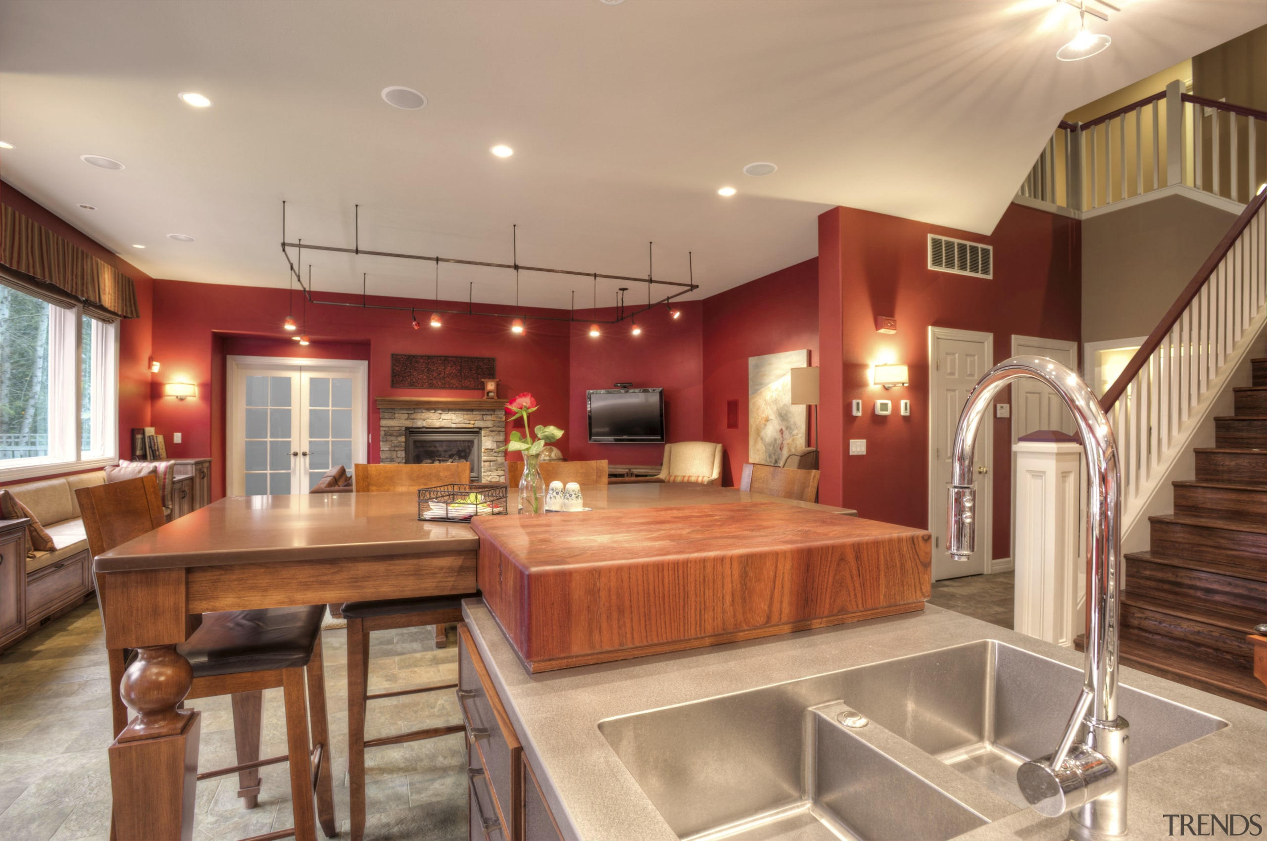 This Richard Landon kitchen has a warm aesthetic cabinetry, ceiling, countertop, interior design, kitchen, real estate, room, orange