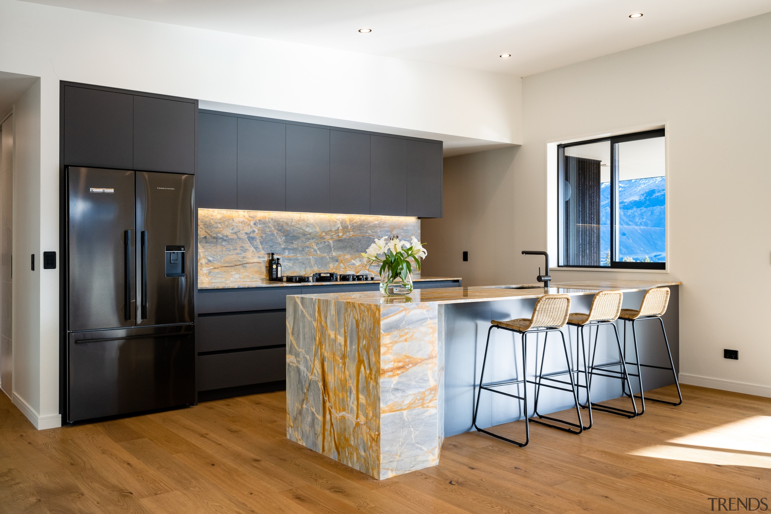 Family kitchen with lake-colour stone accents. 