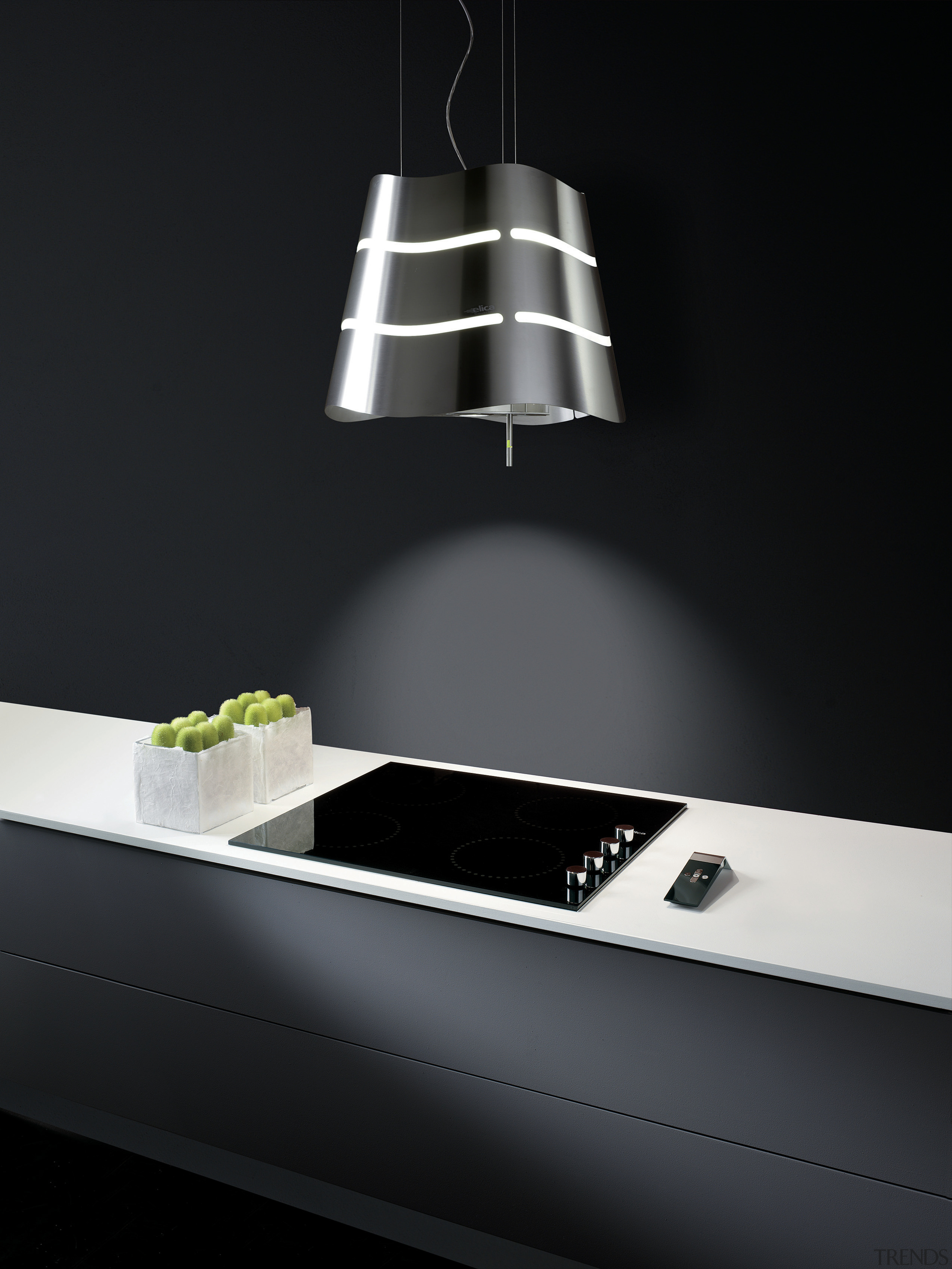 With a fully integrated kitchen design, appliances are ceiling fixture, lamp, light, light fixture, lighting, lighting accessory, product design, tap, black