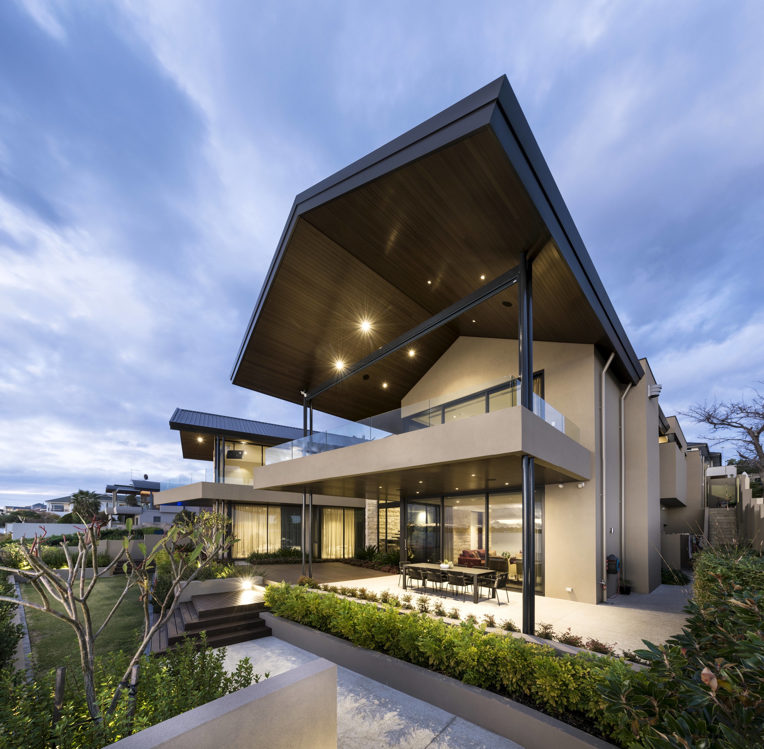 On this home, two semi-cantilevered wings stretch out architecture, building, corporate headquarters, estate, facade, home, house, property, real estate, residential area, sky, teal