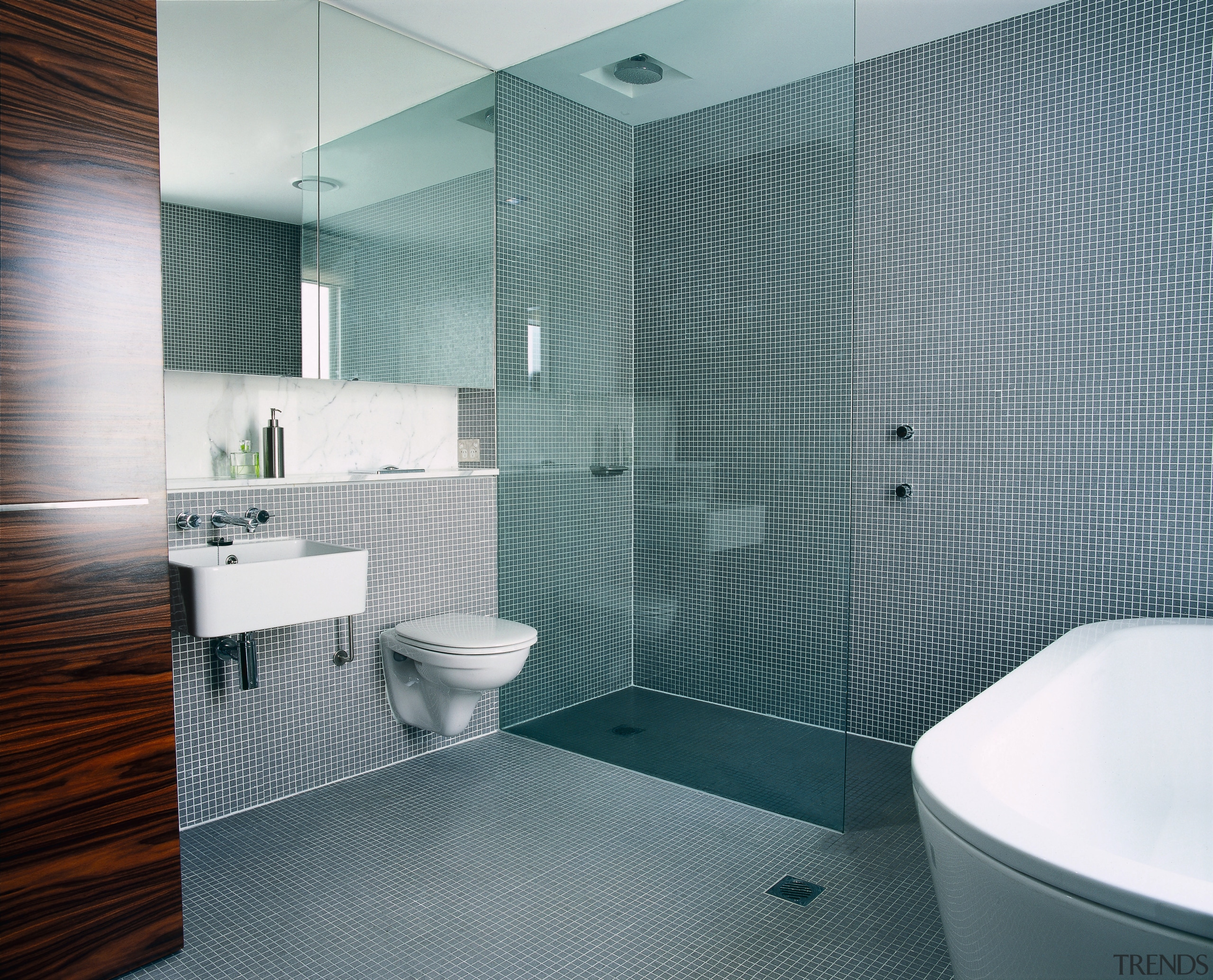 A view of a bathroom, tiled floor and architecture, bathroom, ceiling, daylighting, floor, glass, interior design, plumbing fixture, product design, room, tile, wall, gray, white