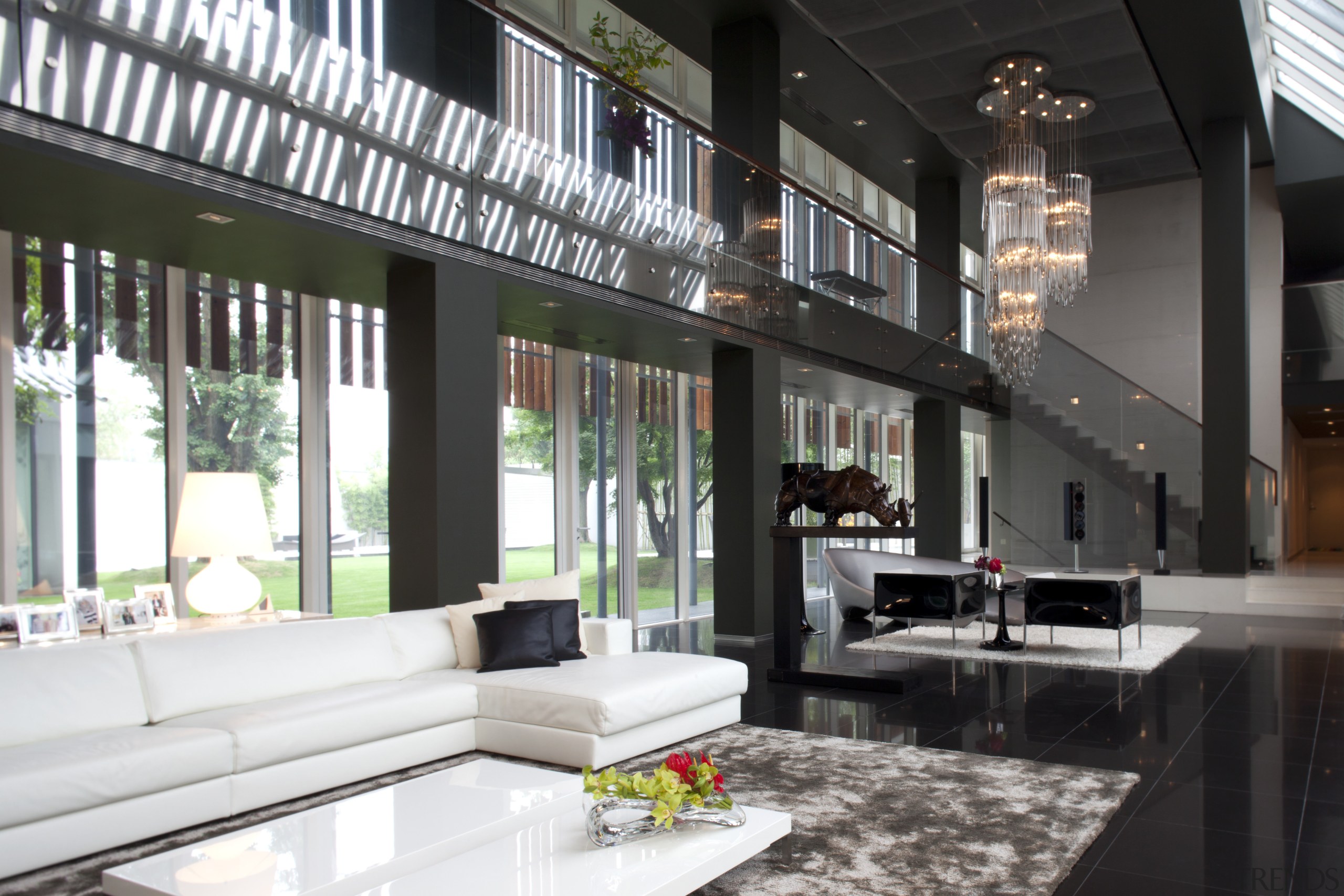 View of living area featuring white sofas, tiled house, interior design, living room, lobby, window, black, white