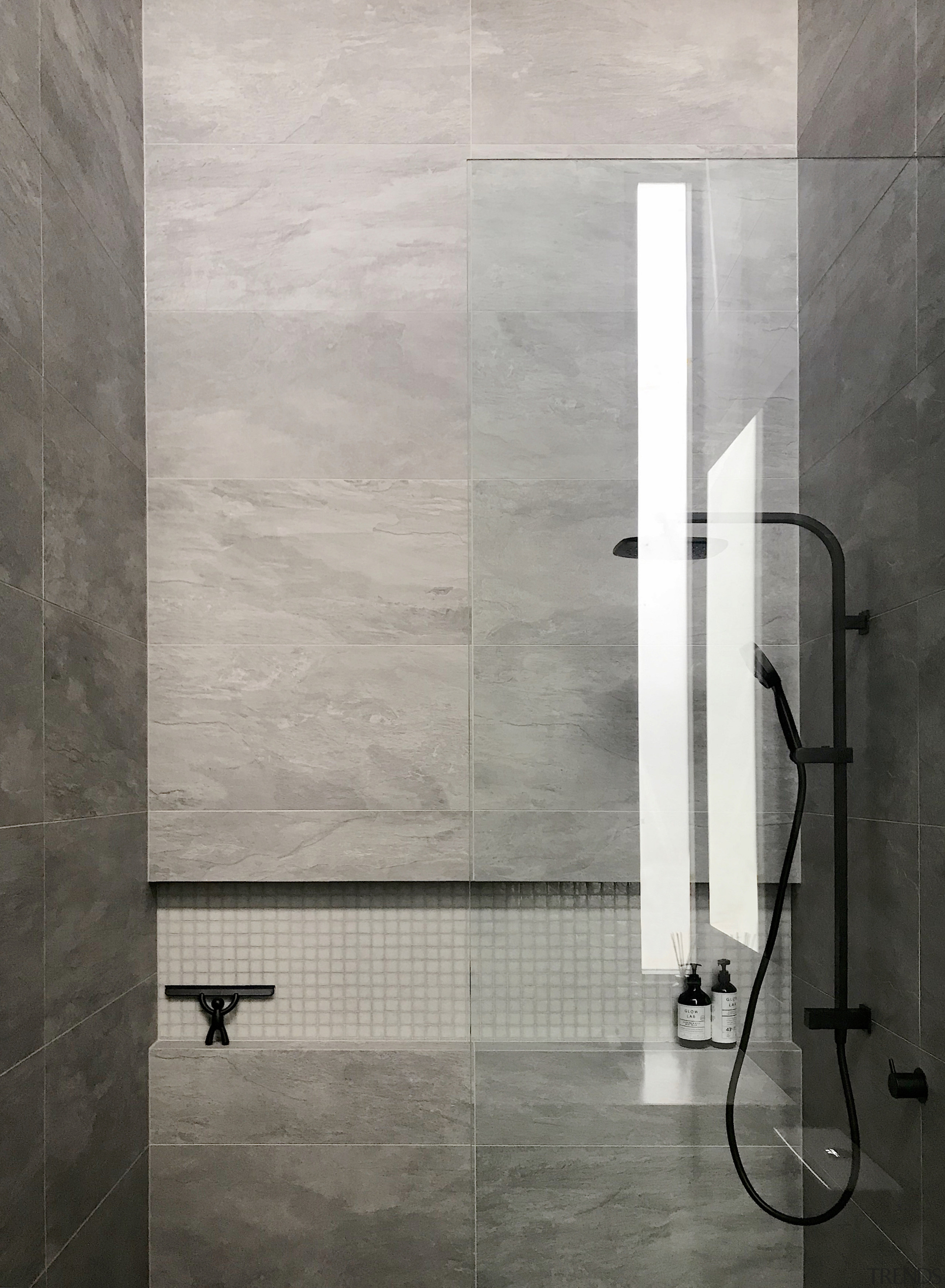 The clean-lined shower in this bathroom includes a 