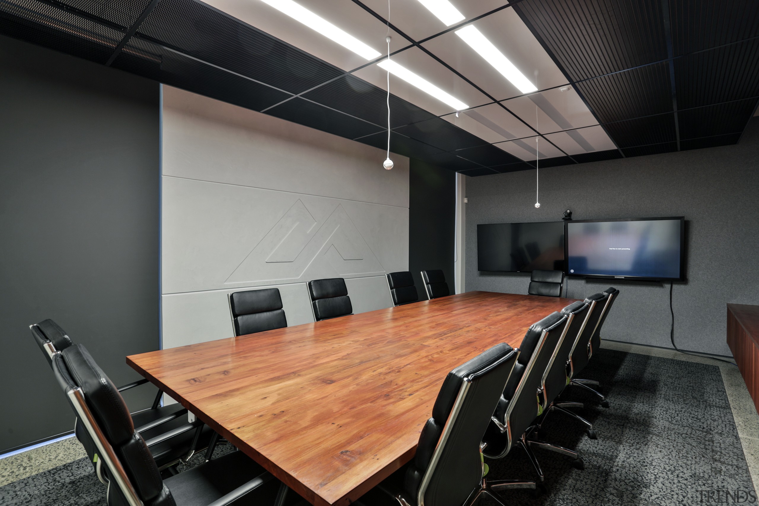 The boardroom table at the Kathmandu headquarters is auditorium, conference hall, interior design, office, table, black, gray