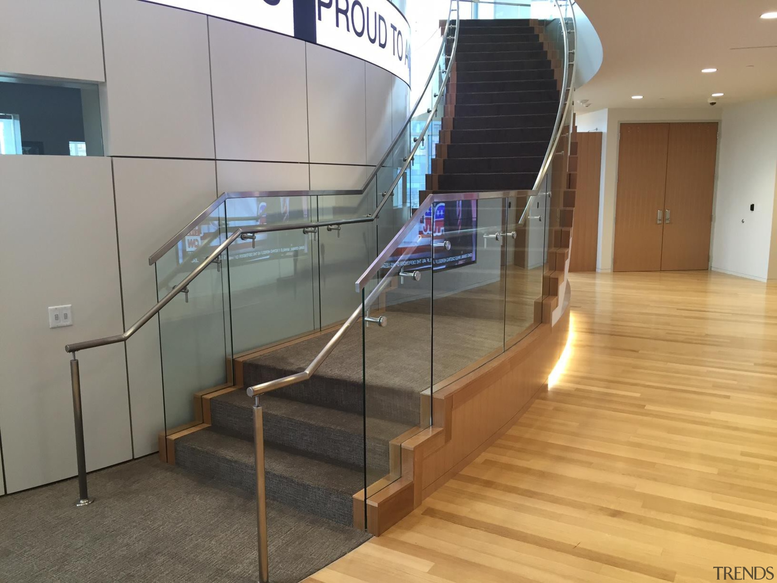 Curved tempered glass designed with precision measurements makes floor, flooring, glass, handrail, stairs, gray