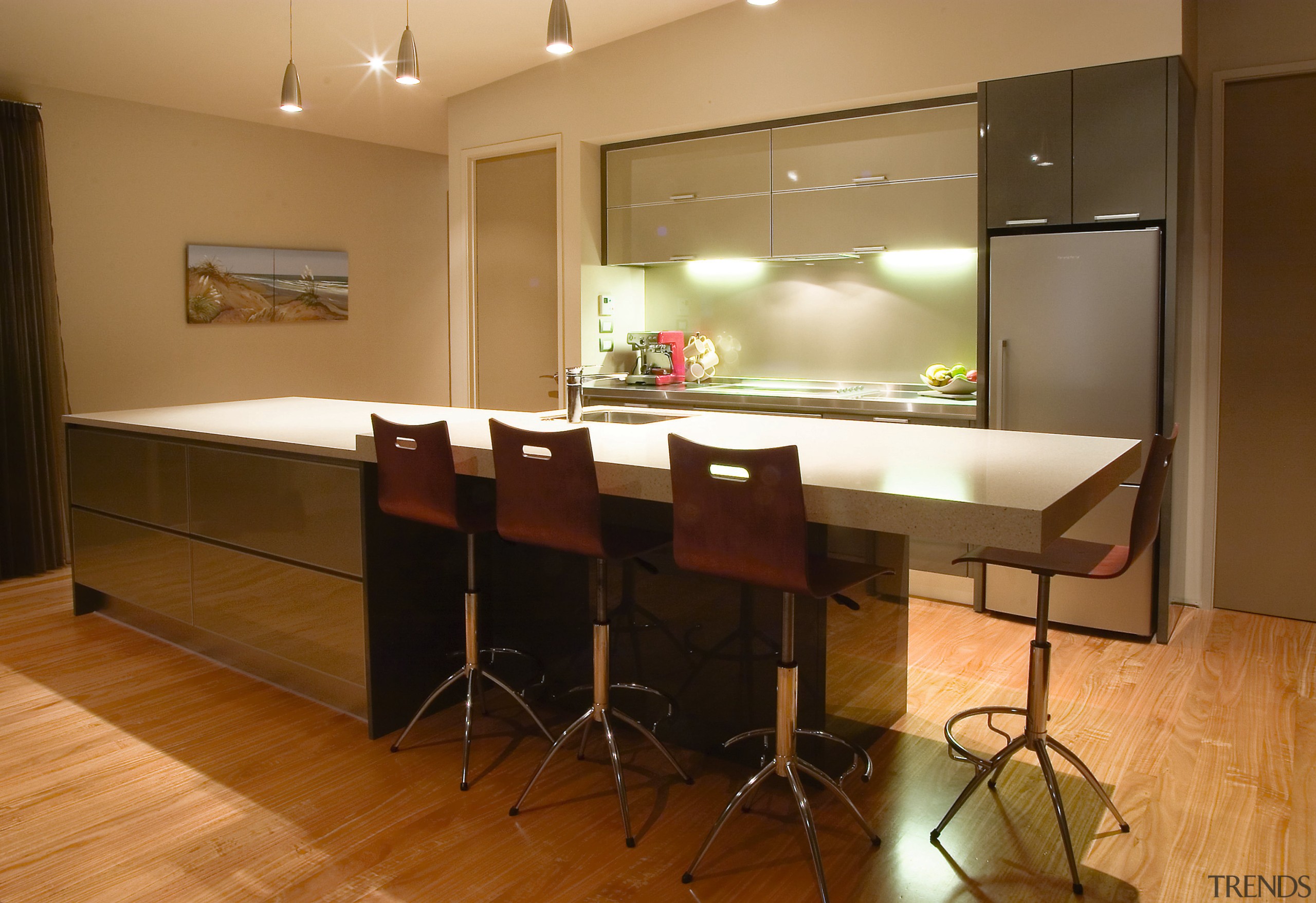 View of kitchen with light coloured countertop, and cabinetry, countertop, floor, flooring, hardwood, interior design, kitchen, real estate, room, table, wood flooring, brown