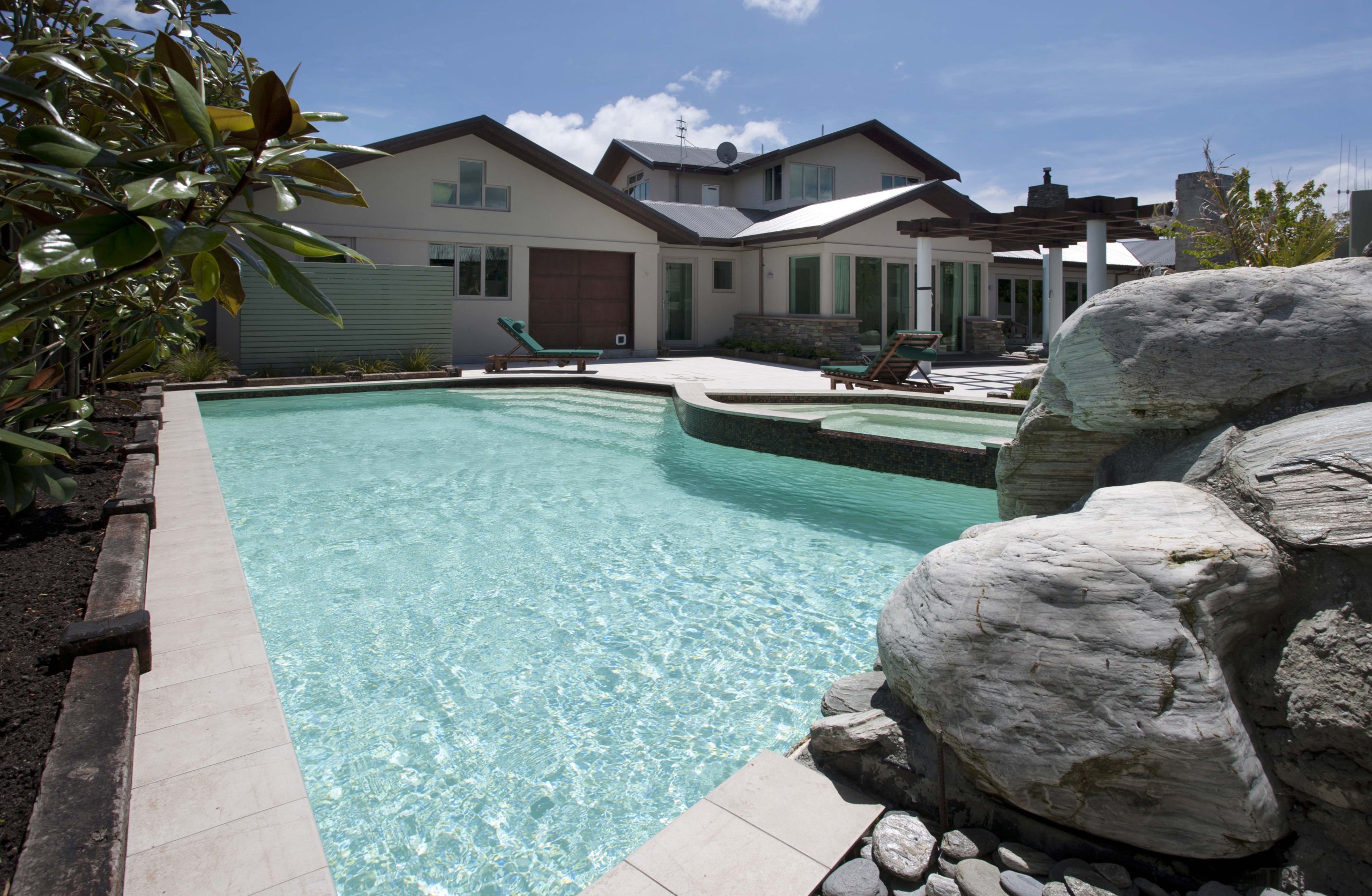 View of contemporary house with pool. - View estate, home, house, leisure, property, real estate, resort, swimming pool, villa, water, teal, black