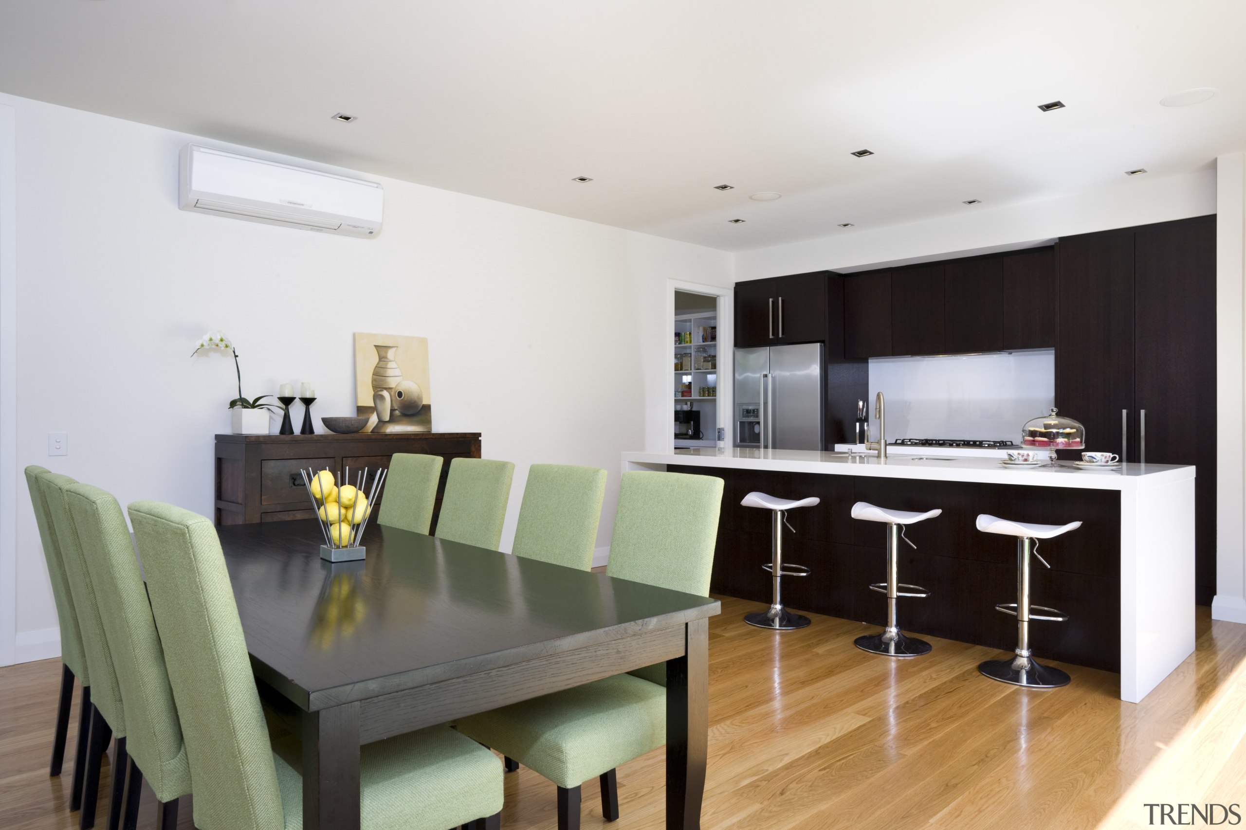 Image of the dining area in this home dining room, house, interior design, kitchen, property, real estate, room, table, white