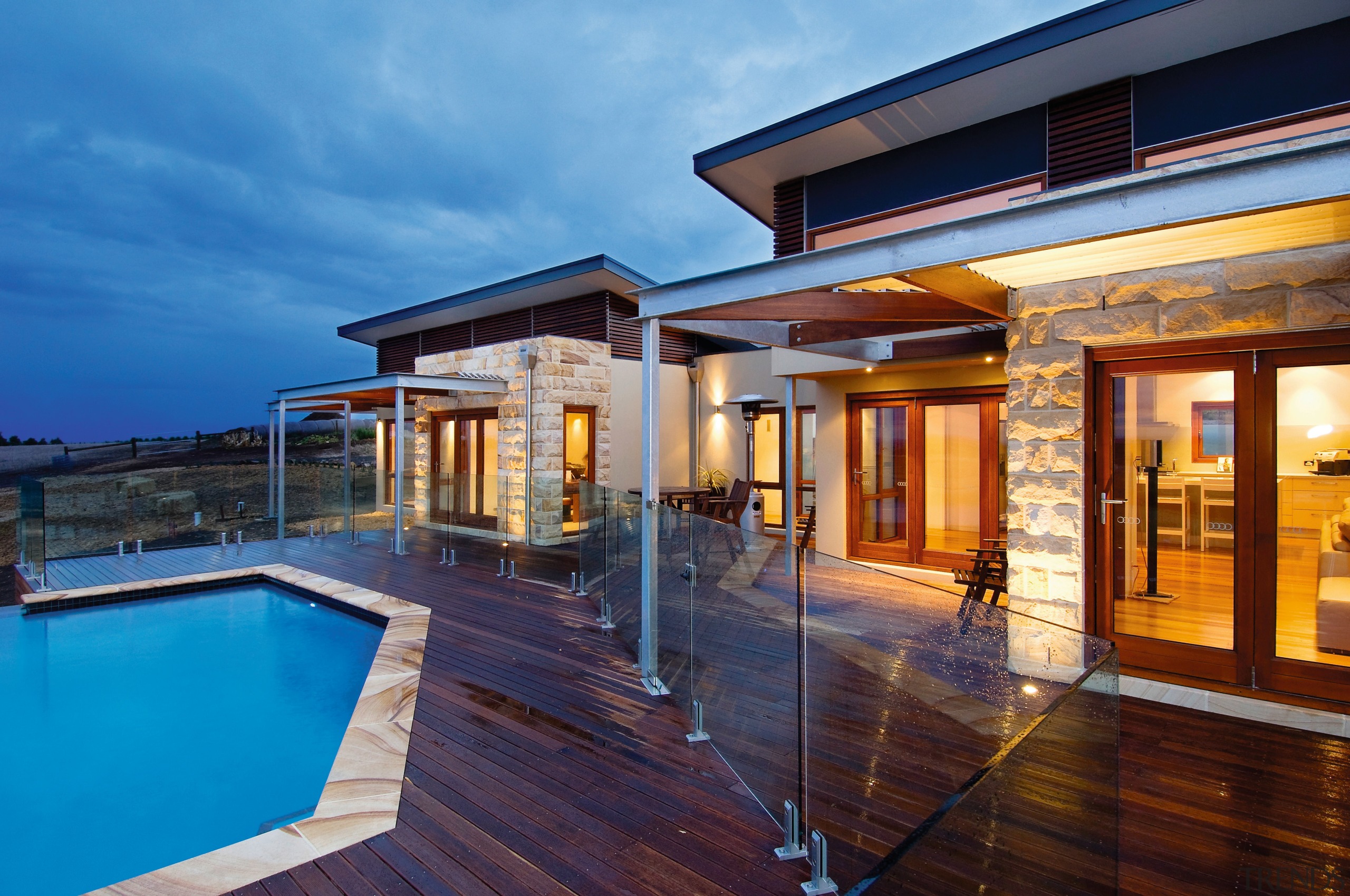 Exterior view of an energy-efficient home which was apartment, architecture, deck, estate, facade, home, house, property, real estate, siding, swimming pool, villa, window, teal