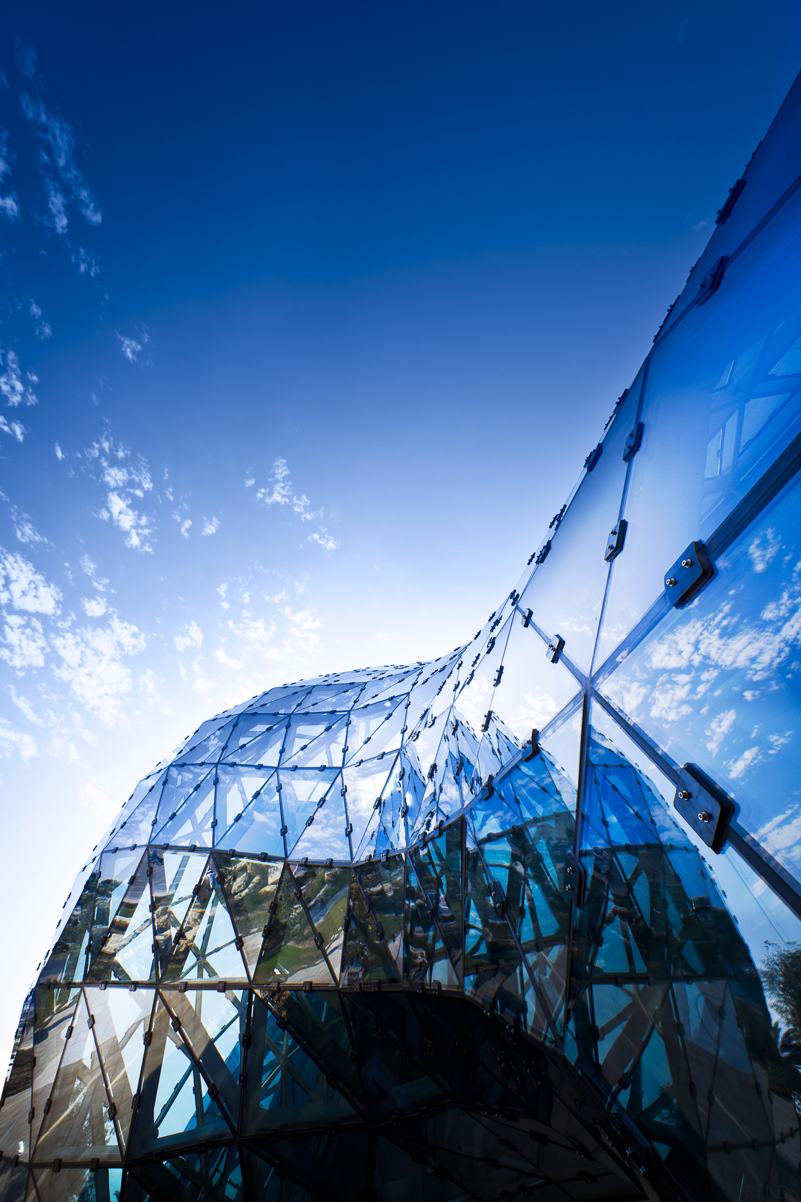 View of new art museum designed to house architecture, blue, cloud, daytime, landmark, reflection, sky, structure, tourist attraction, tree, blue