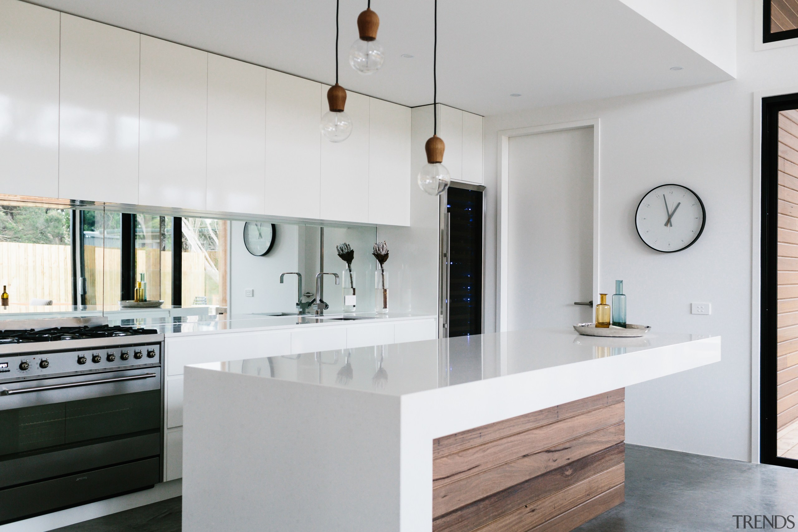 This kitchen combines white surfaces with timber finishes. architecture, cabinetry, countertop, cuisine classique, interior design, kitchen, real estate, gray