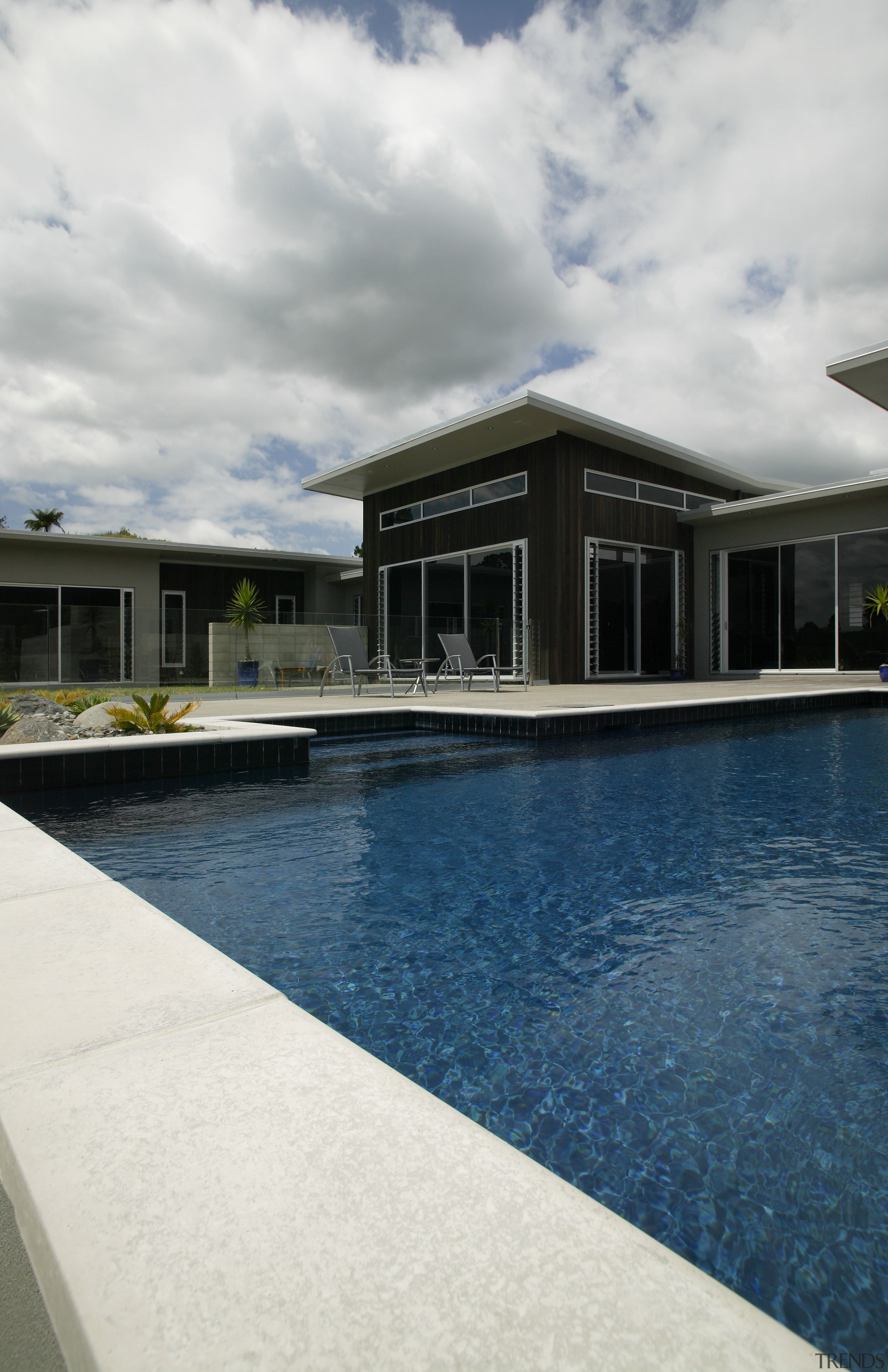 view of pool by Pool Resources. - view architecture, cloud, estate, home, house, property, real estate, reflection, sky, swimming pool, water, white