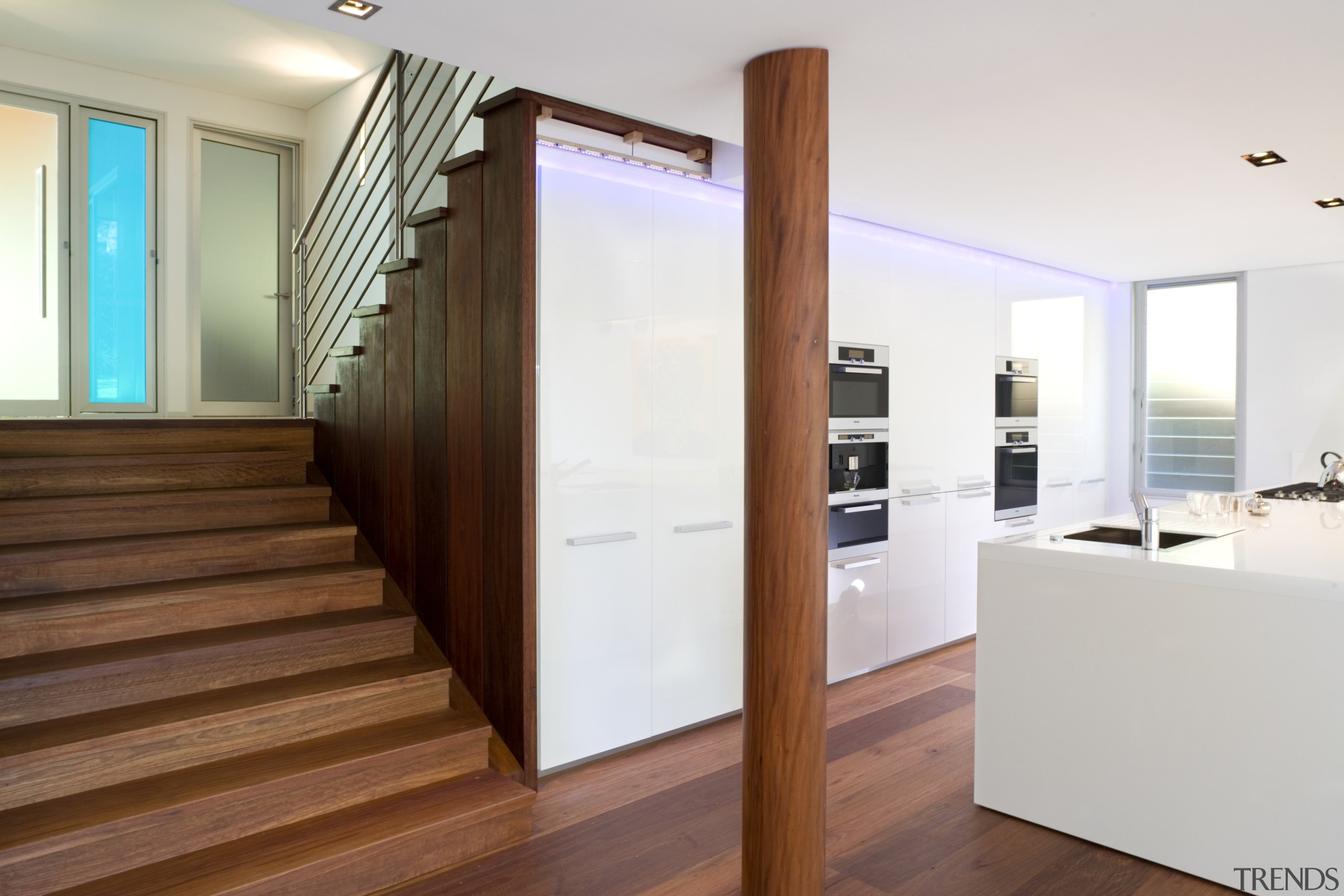 View of kitchen design by Linda Haefeli, and door, floor, flooring, hardwood, interior design, real estate, wood, wood flooring, white, brown