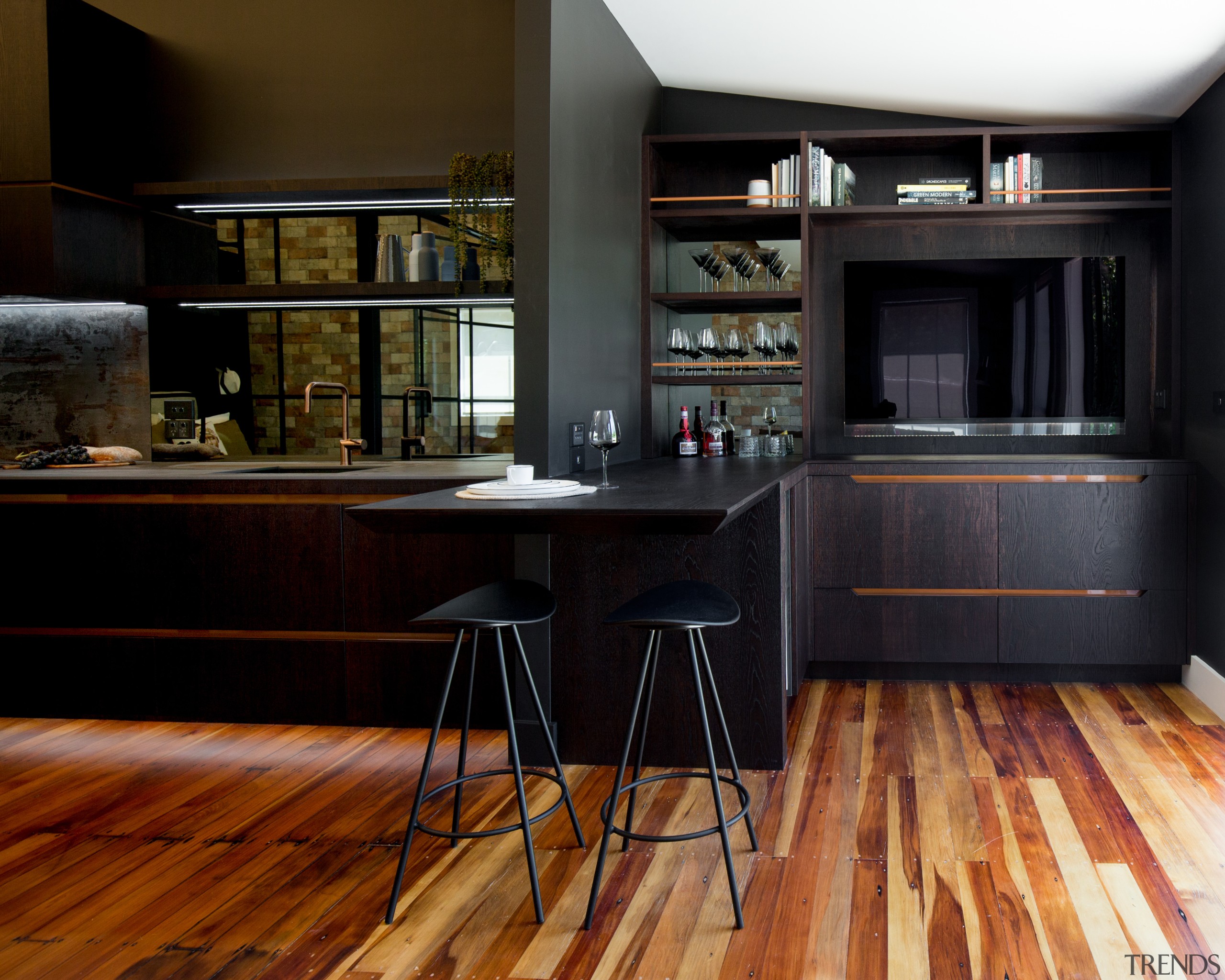 ​​​​​​​Dark veneer finish matched with copper accents on black, brown