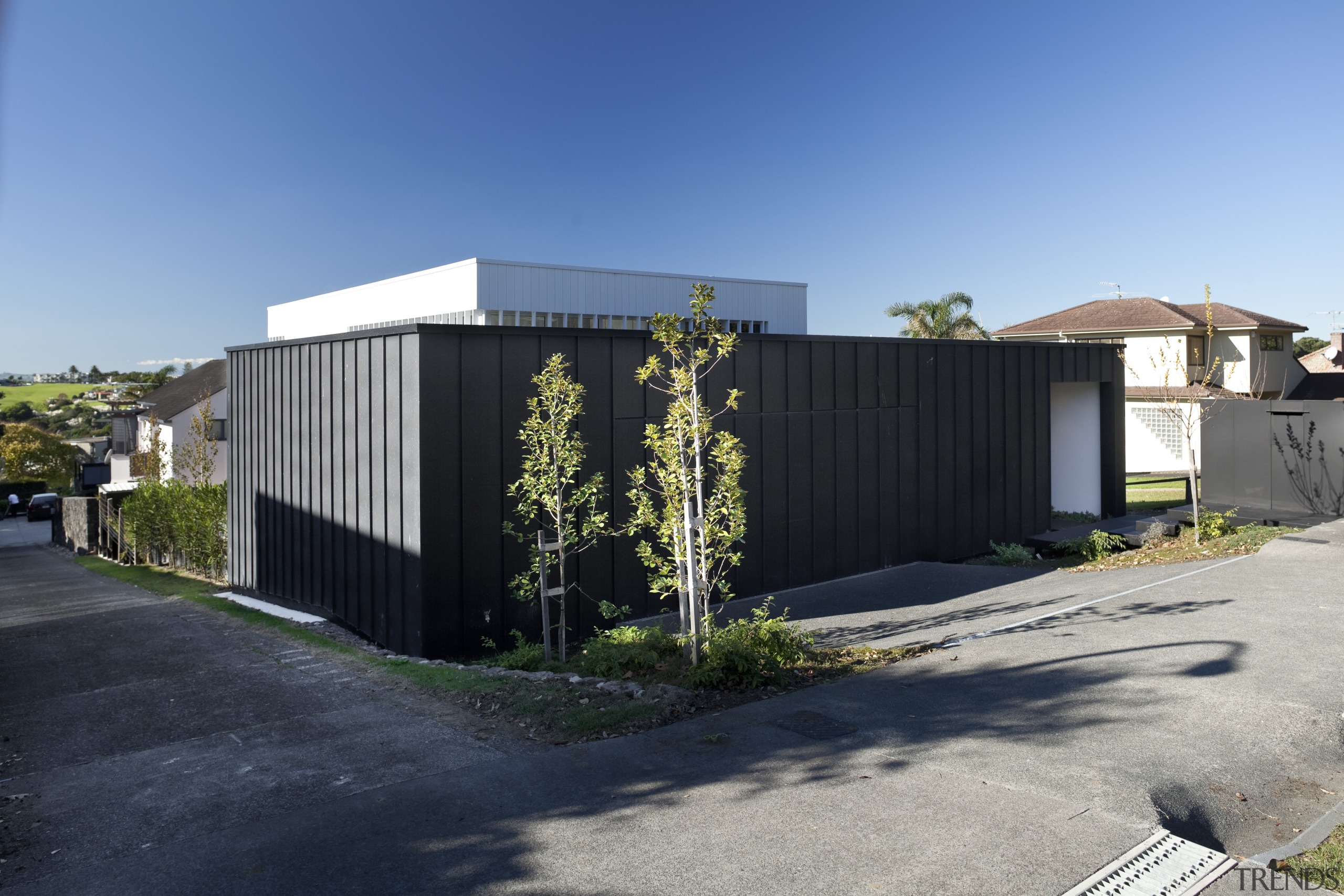 Solid, dark charcoal-coloured zinc walls give little hint architecture, facade, home, house, property, real estate, residential area, shed, black, teal