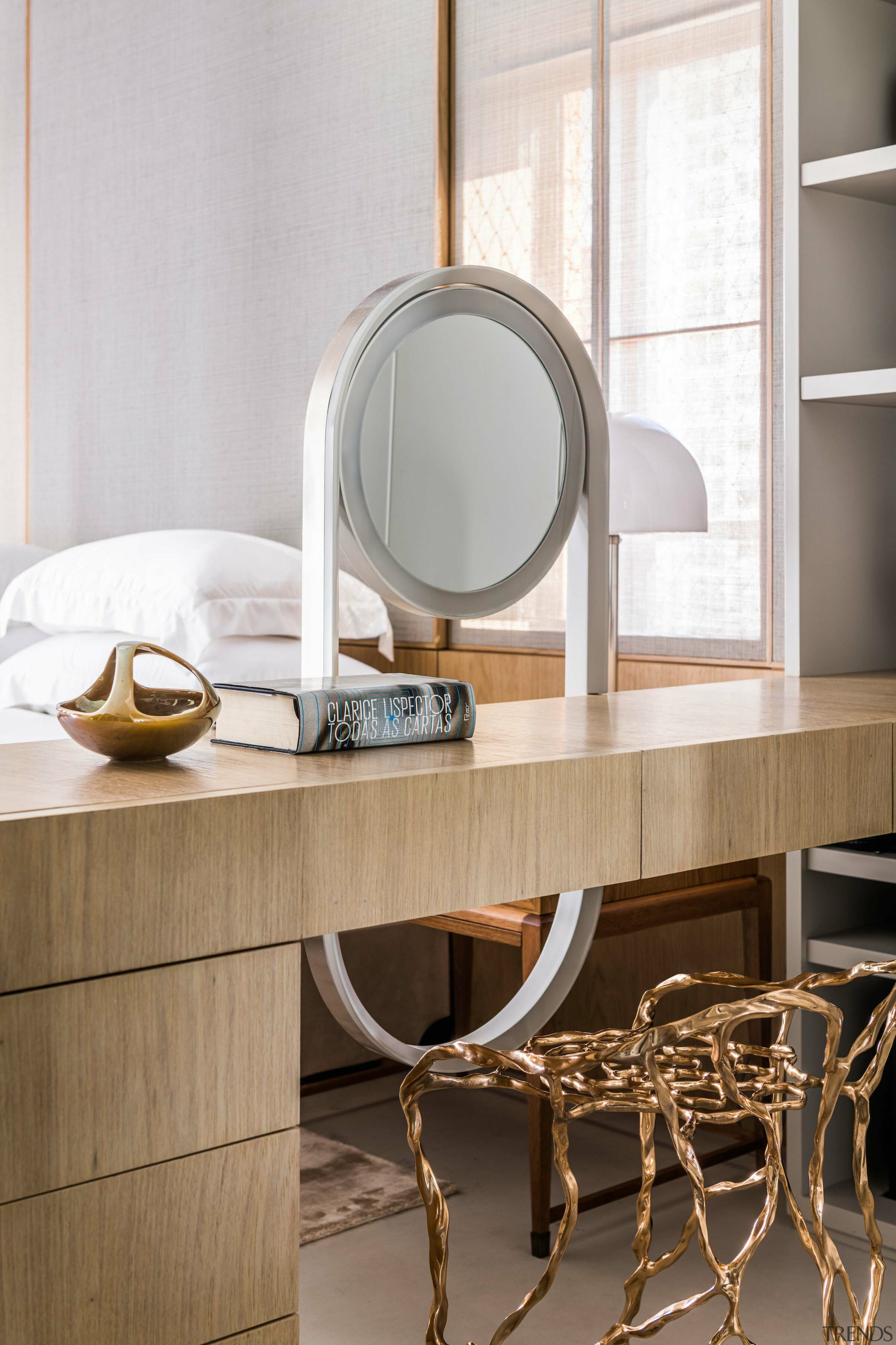 The in-bedroom office doubles as a makeup station. 