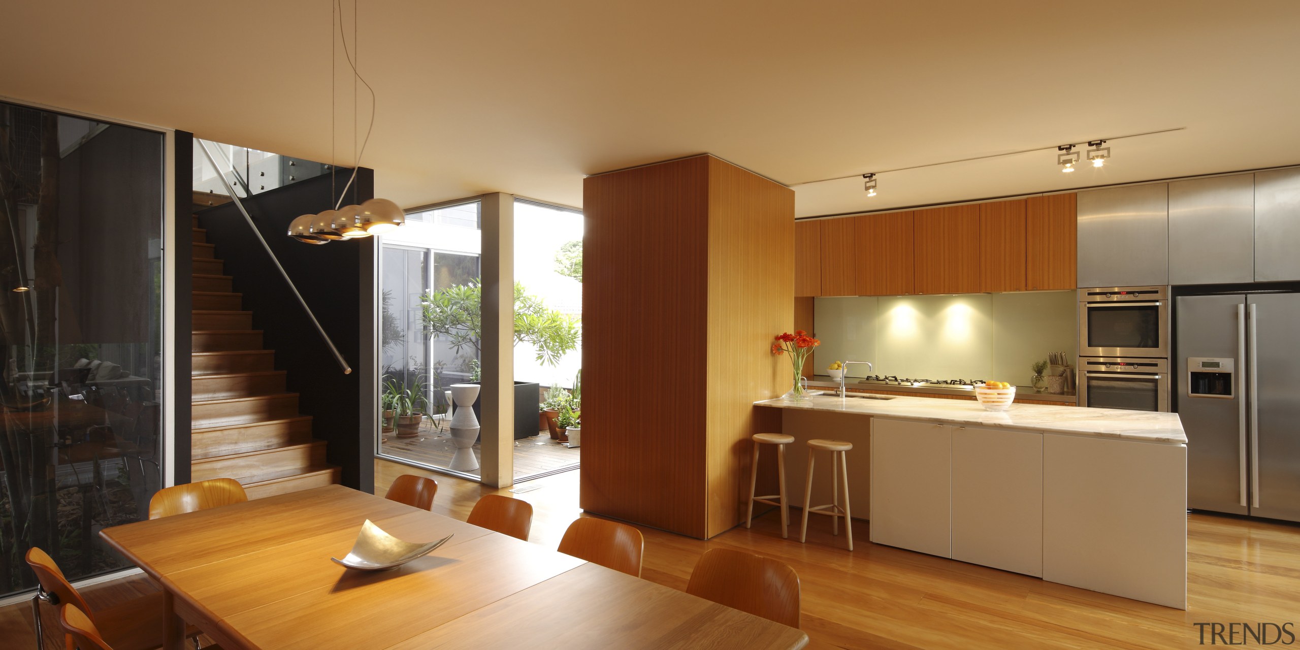 View of kitchen and dining area with wooden architecture, house, interior design, kitchen, real estate, orange, brown