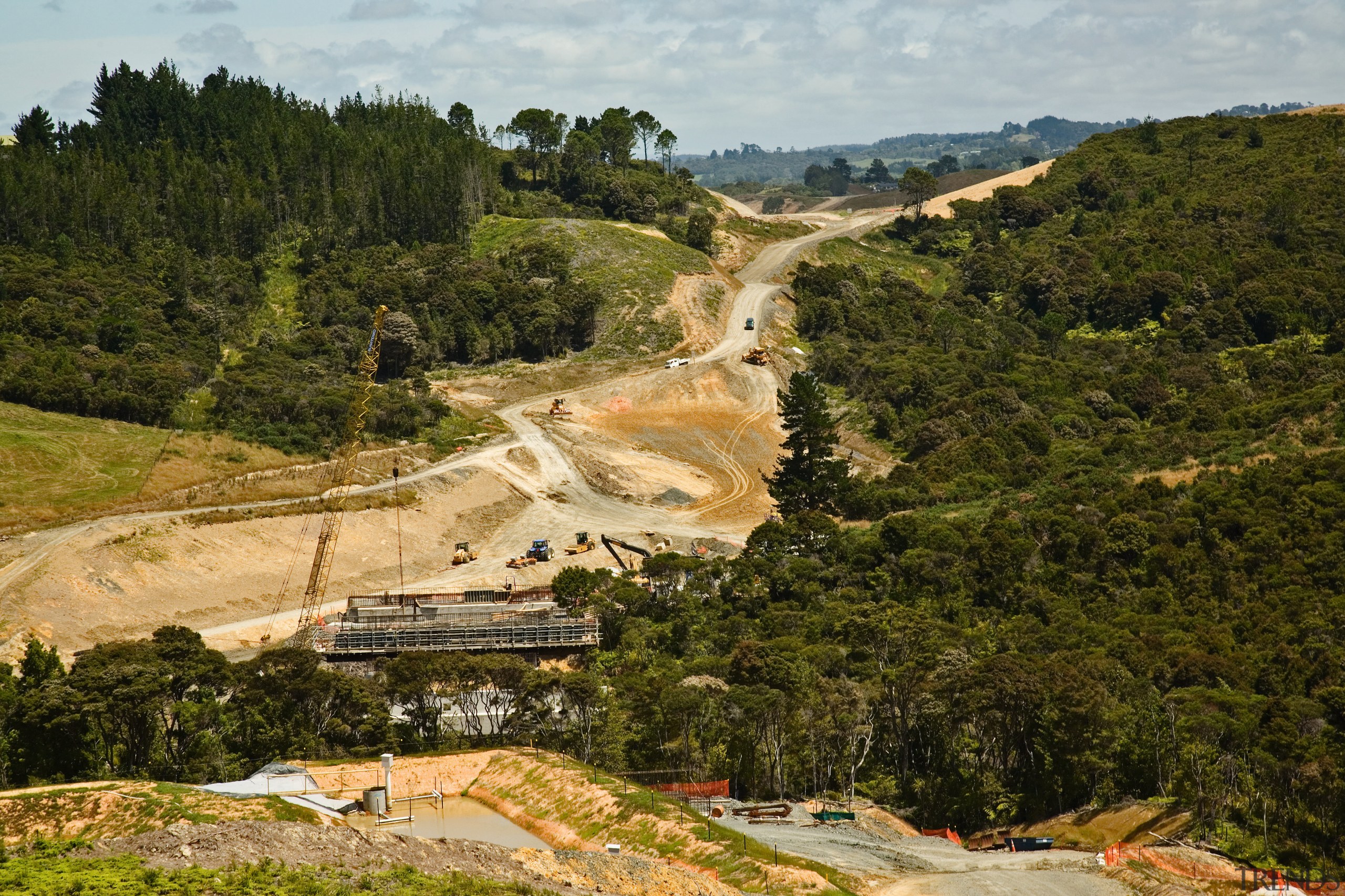A view of the concrete piers and bridges geological phenomenon, hill, hill station, landscape, mountain, mountain pass, road, rural area, sky, tree, brown