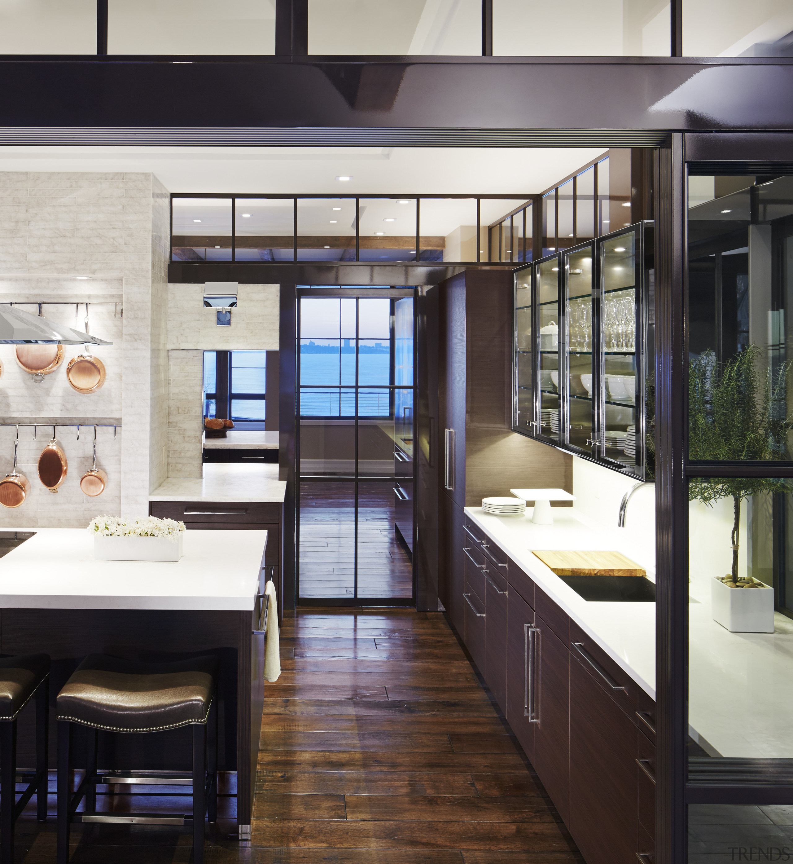 This fully functioning kitchen sits behind the homes countertop, interior design, kitchen, black, white