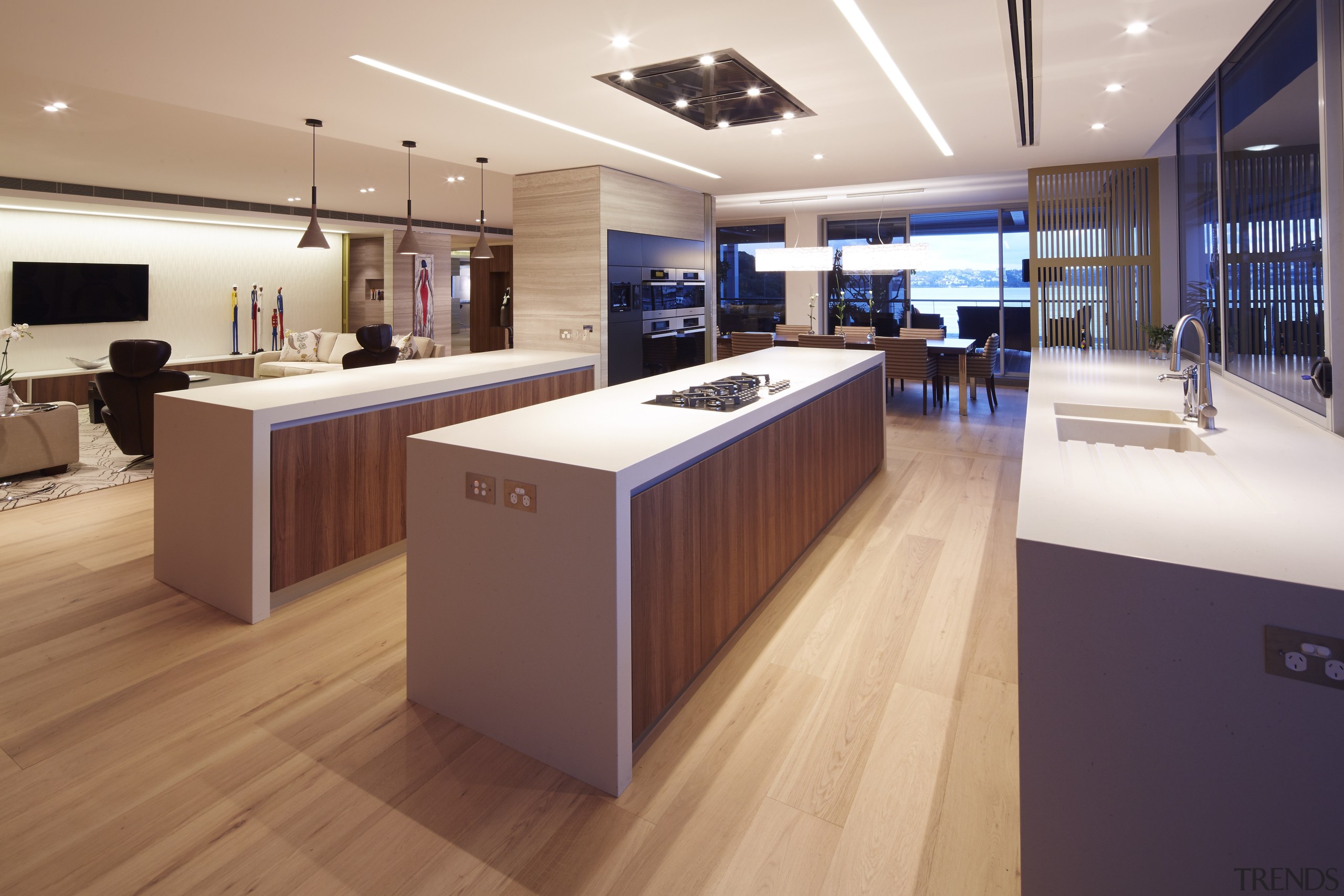 This entertainers kitchen with parallel islands and a countertop, floor, flooring, interior design, kitchen, wood