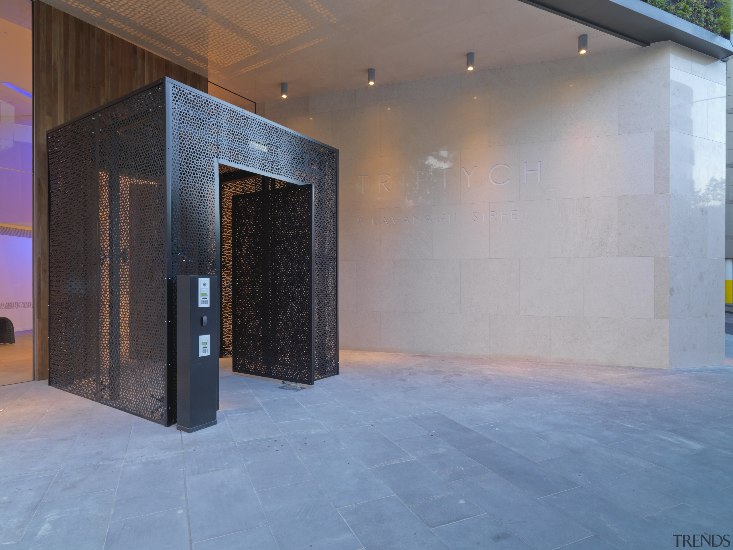 View of entrance to Tripych apartments with metal architecture, facade, floor, flooring, lighting, property, real estate, wall, gray, teal