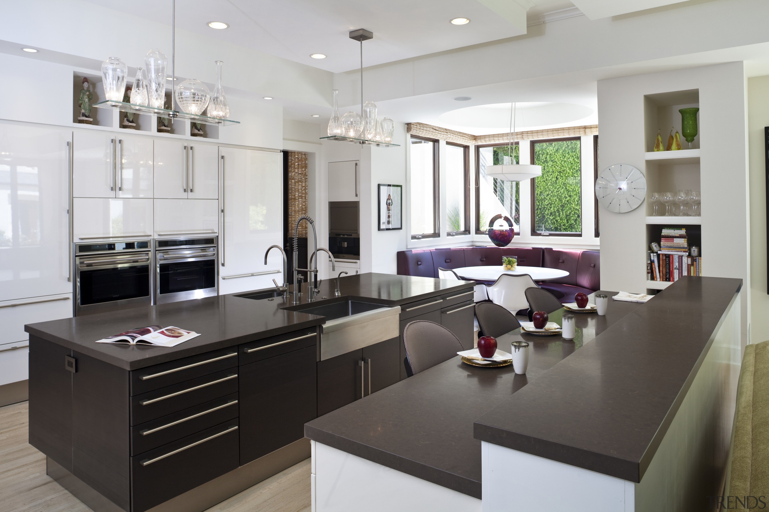 View of contemporary kitchen wooden flooring, dark cabinetry cabinetry, countertop, cuisine classique, interior design, interior designer, kitchen, living room, room, gray