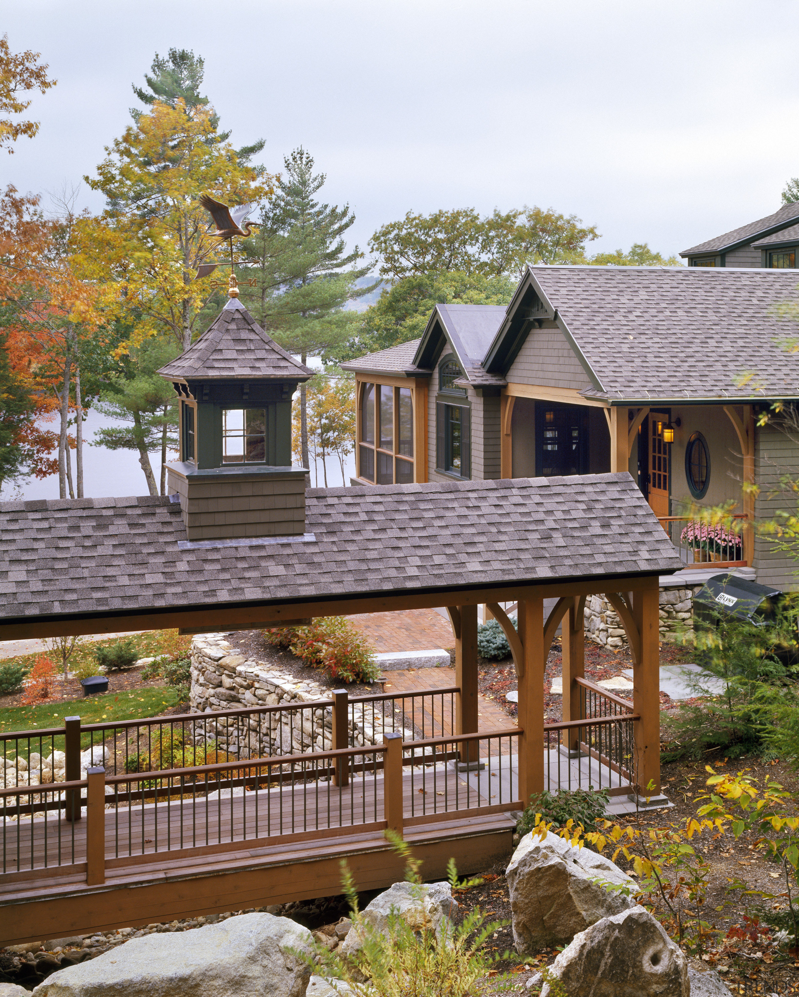 View of the holiday homes exterior featuring white cottage, home, house, outdoor structure, plant, property, real estate, roof, siding, tree, wood, brown