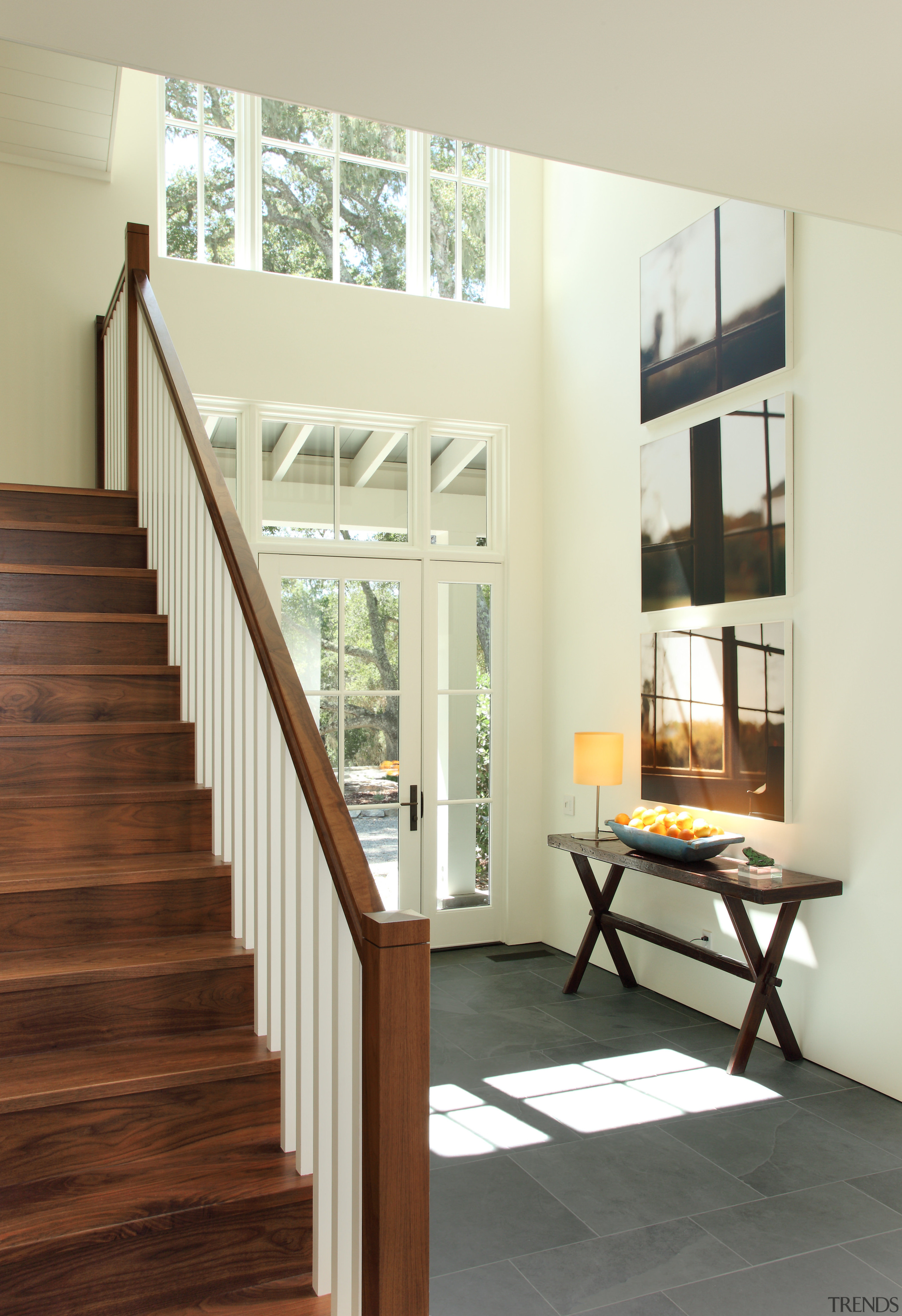 Wooden stairs with grey tile flooring and small architecture, daylighting, door, floor, flooring, handrail, hardwood, home, house, interior design, stairs, window, wood, wood flooring, yellow, white