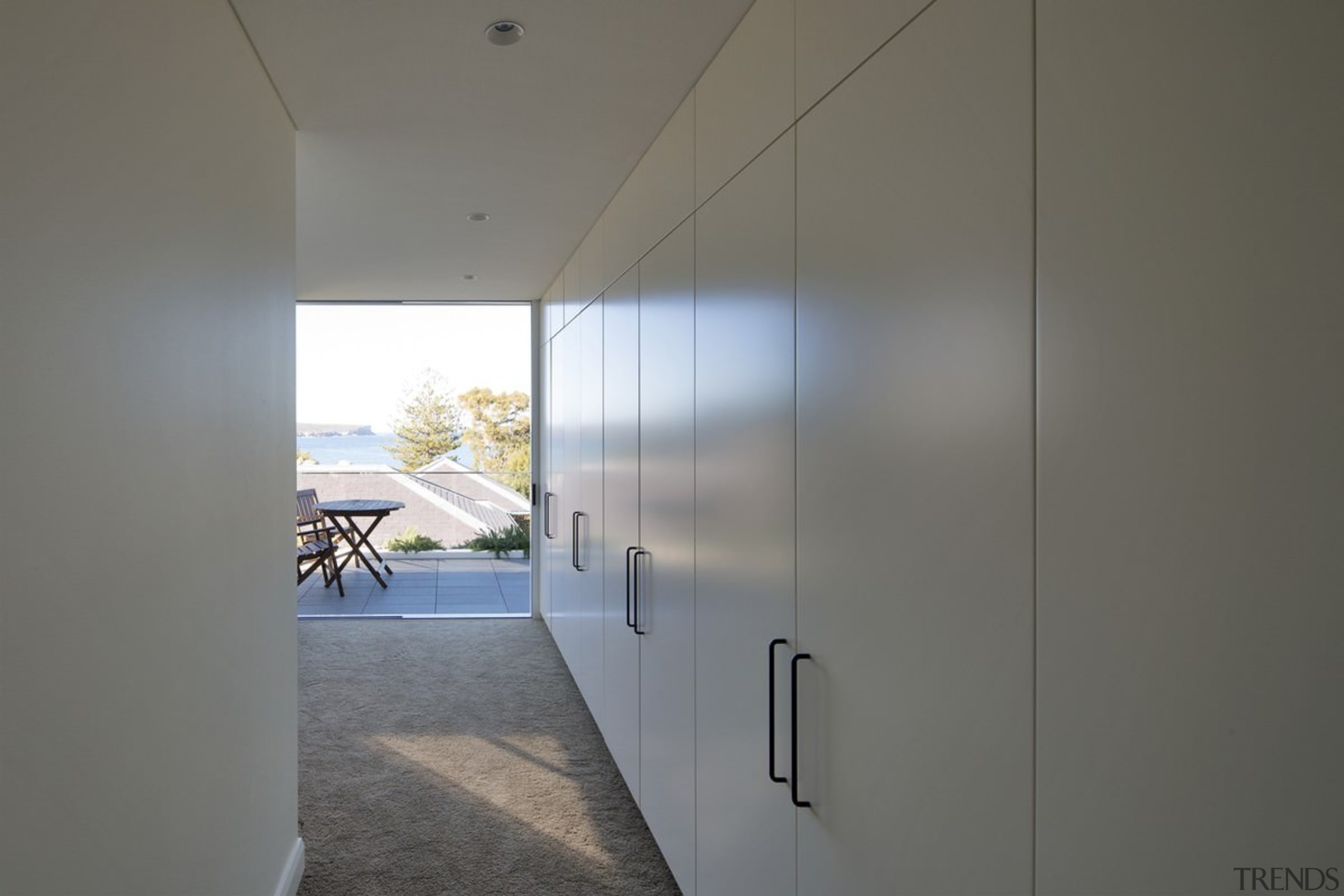 There's plenty of storage lining this wall - architecture, ceiling, daylighting, house, interior design, real estate, wall, window, gray