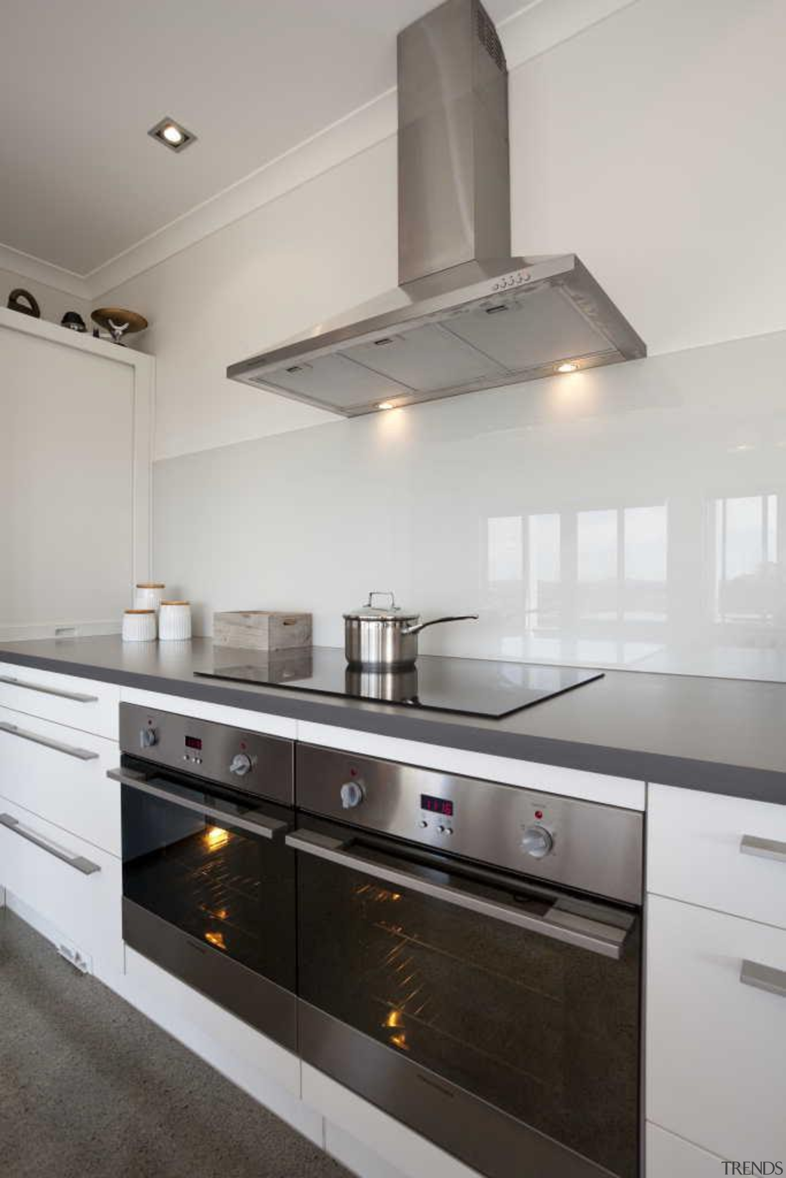 White kitchen with a glossy wall - Kitchen cabinetry, ceiling, countertop, cuisine classique, home appliance, interior design, kitchen, kitchen appliance, kitchen stove, gray