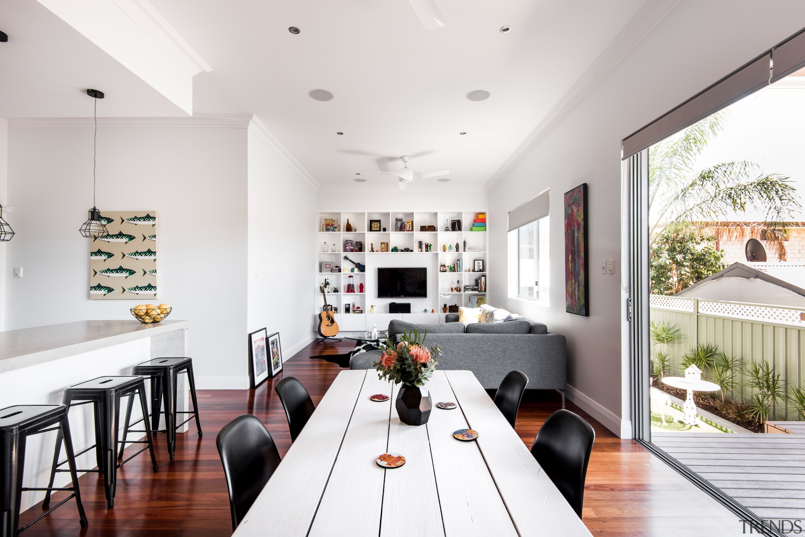 White walls and ceilings ensure the living spaces architecture, building, ceiling, design, dining room, floor, flooring, furniture, home, house, interior design, living room, property, real estate, room, table, wall, white, wood flooring, white