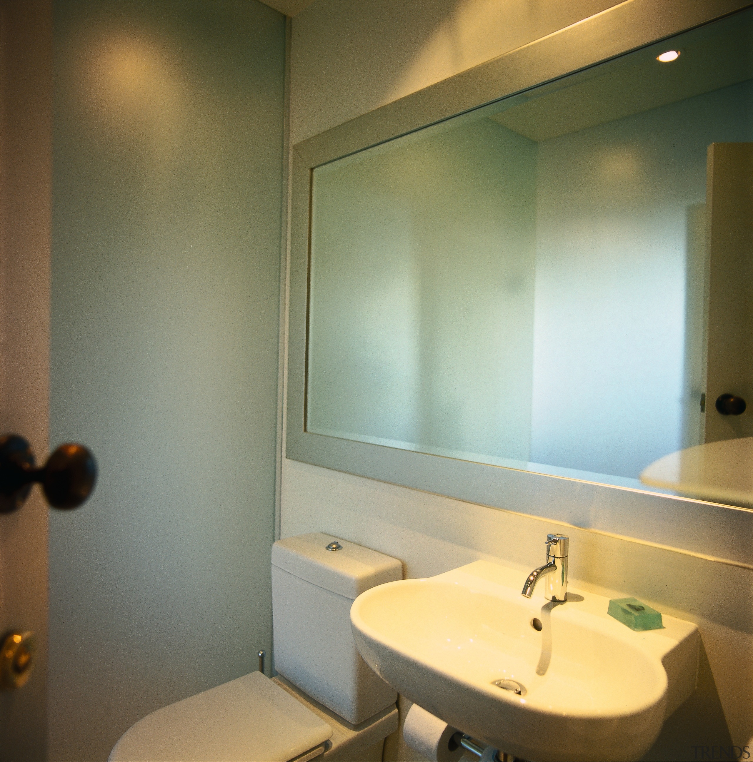 The detail of a toilet and hand basin bathroom, ceiling, interior design, lighting, room, sink, wall, brown, gray