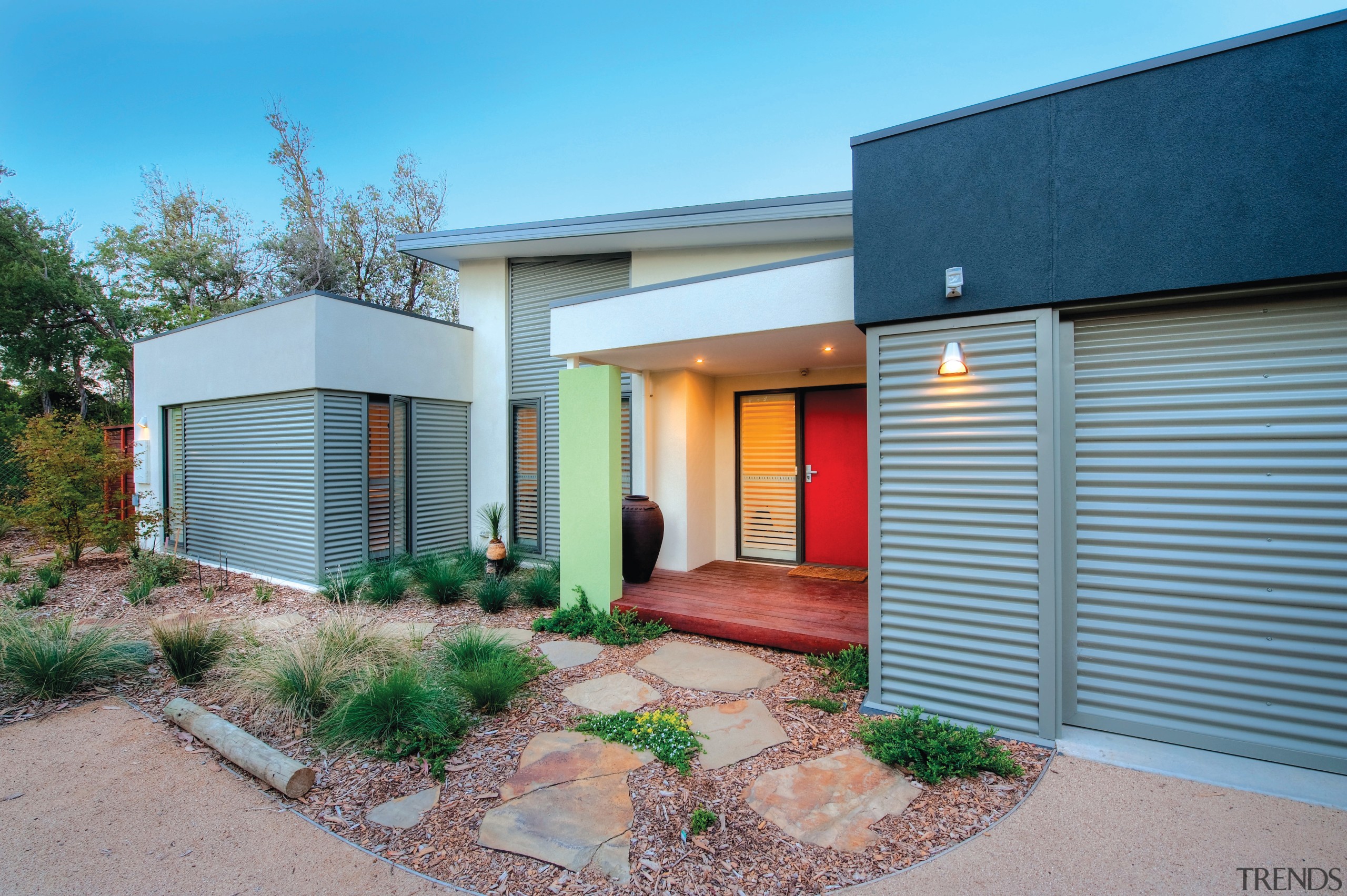Exterior view of an energy-efficient home designed by elevation, estate, facade, home, house, property, real estate, residential area, siding, gray, teal