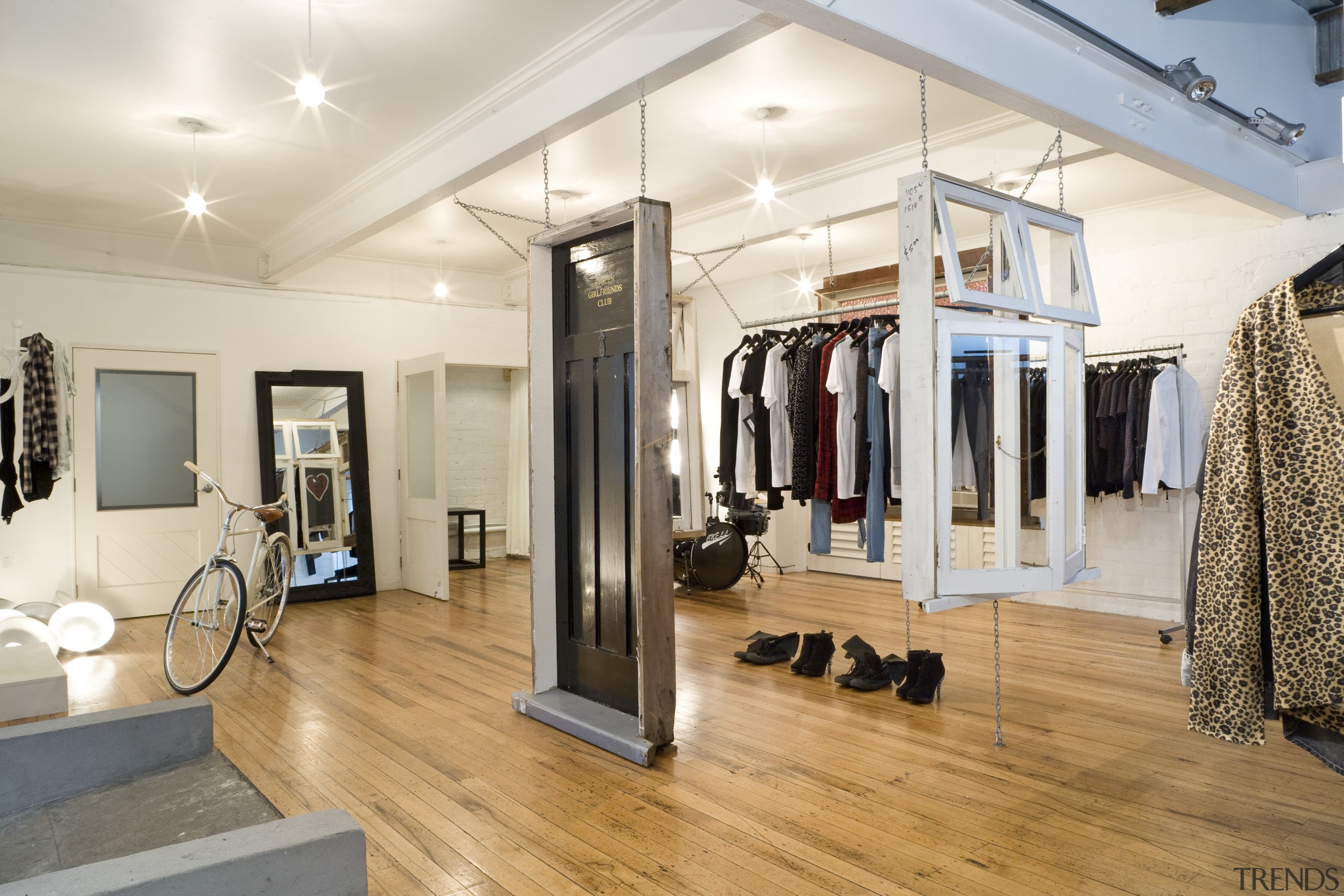 Interior view of the clothing displays at the boutique, floor, flooring, interior design, room, white