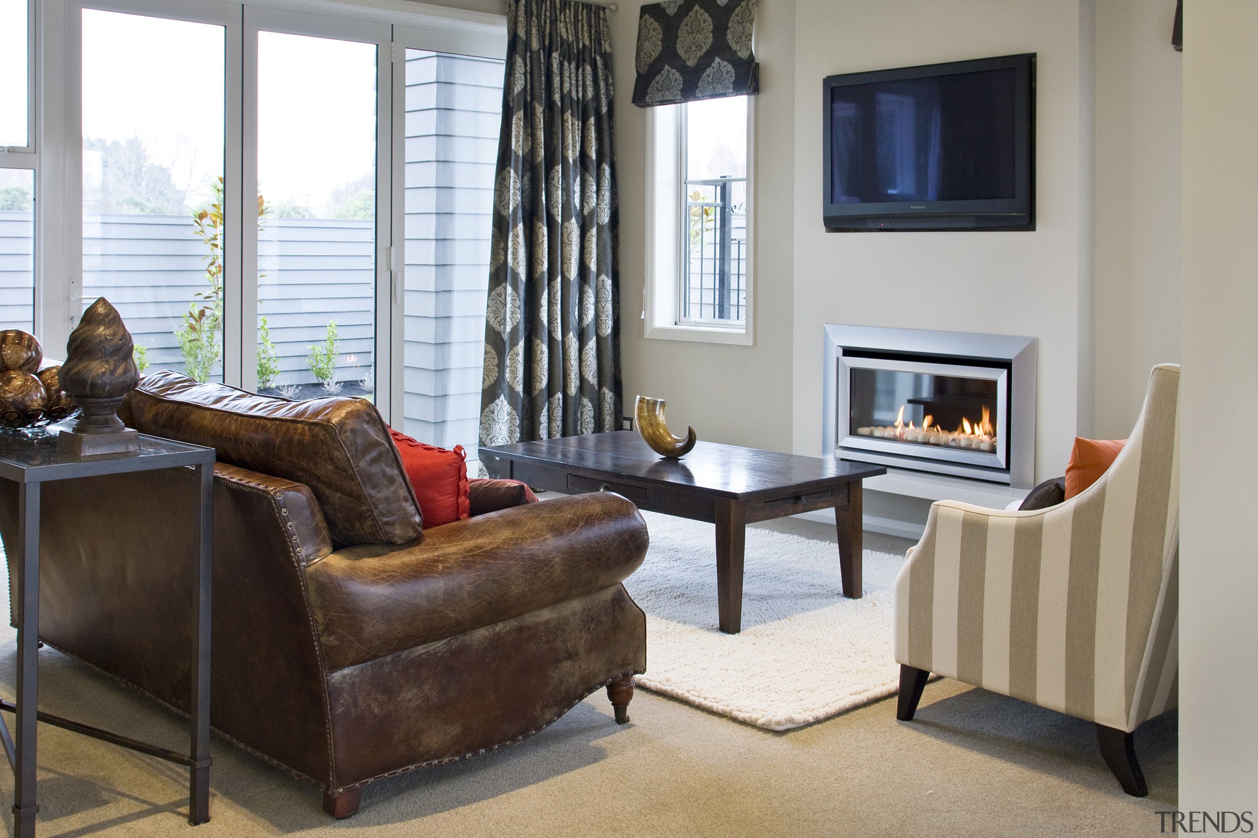 View of main living area of this Landmark chair, floor, flooring, furniture, home, interior design, living room, real estate, room, table, window, gray