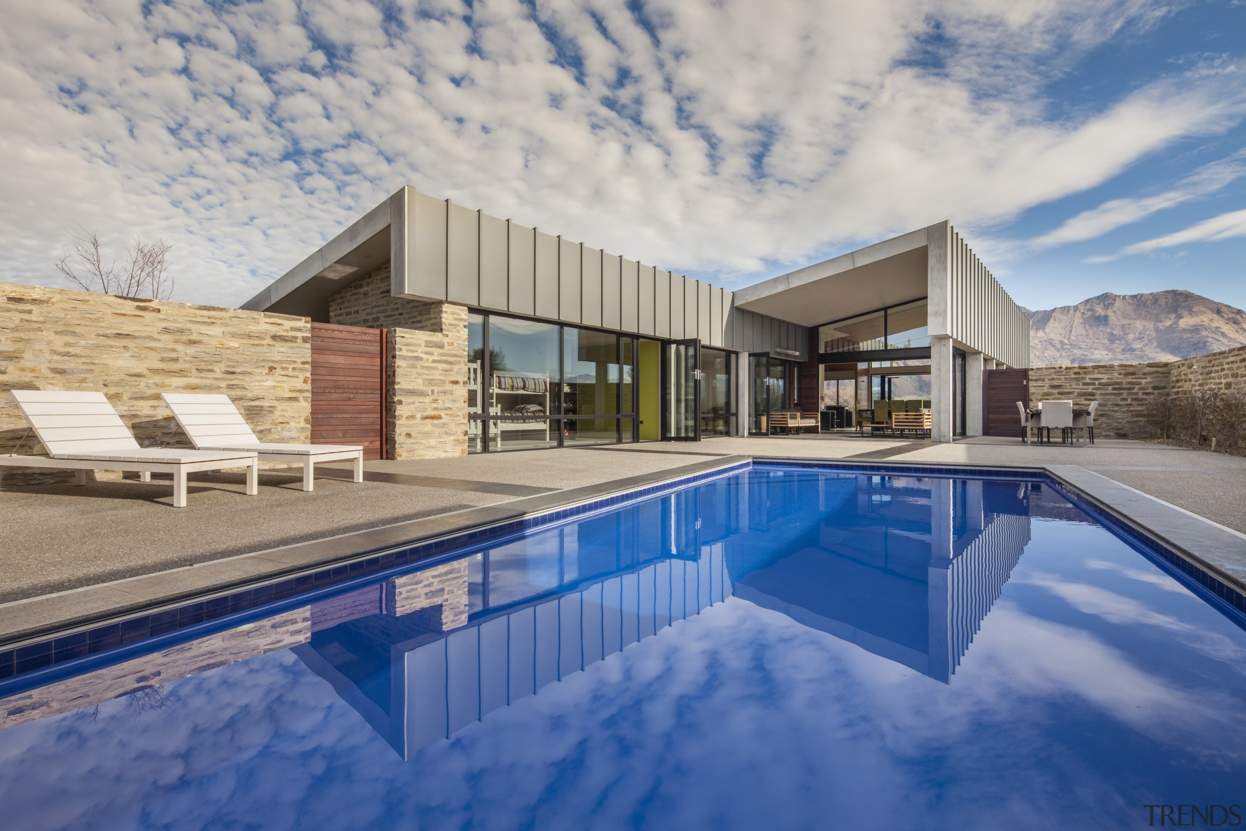 The main living wing of this rural home apartment, architecture, estate, home, house, leisure centre, property, real estate, reflection, sky, swimming pool, villa, water, gray, blue