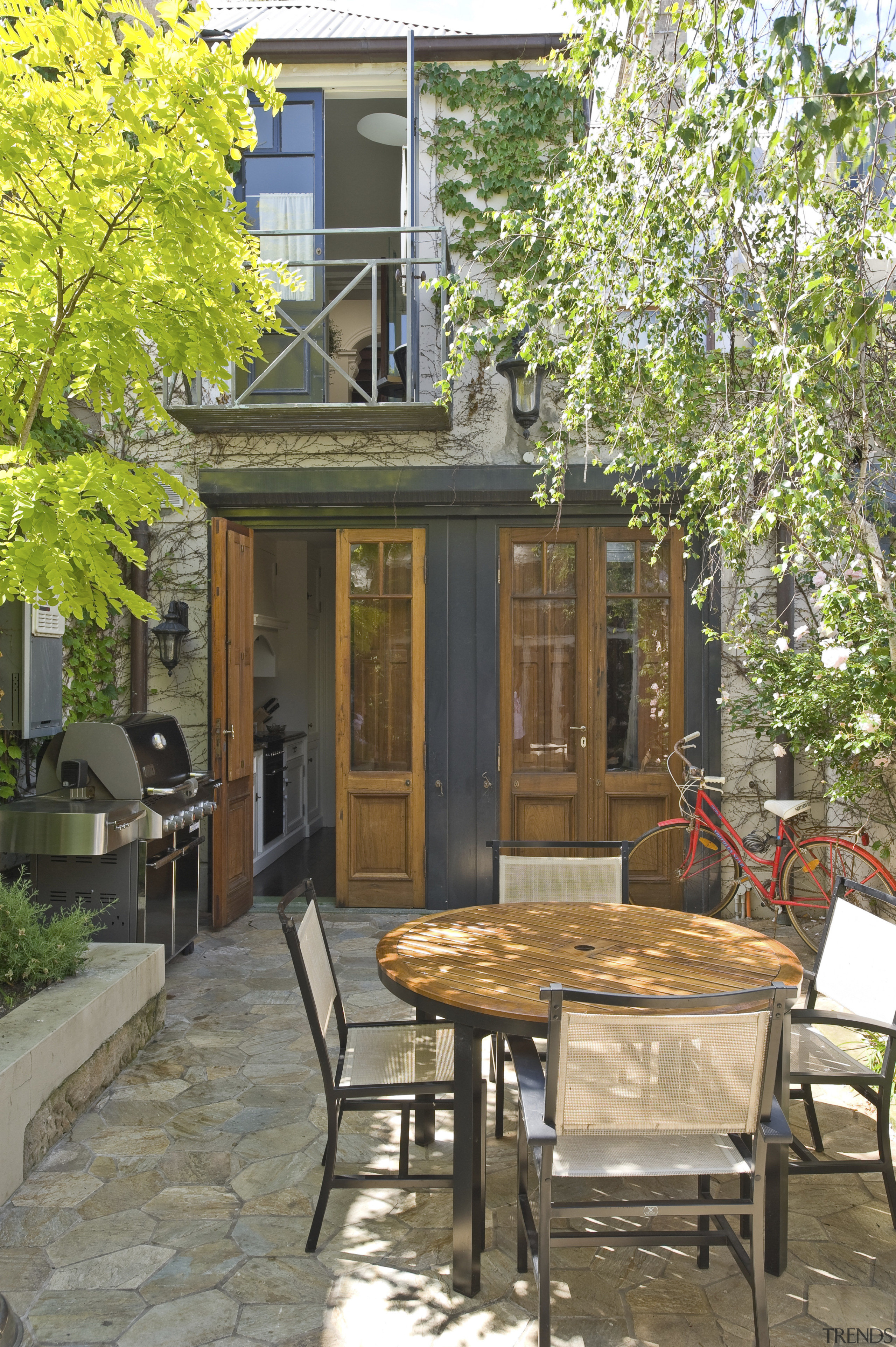 The rear courtyard of this Victorian terrace was backyard, cottage, home, house, outdoor structure, patio, porch, real estate, tree, brown