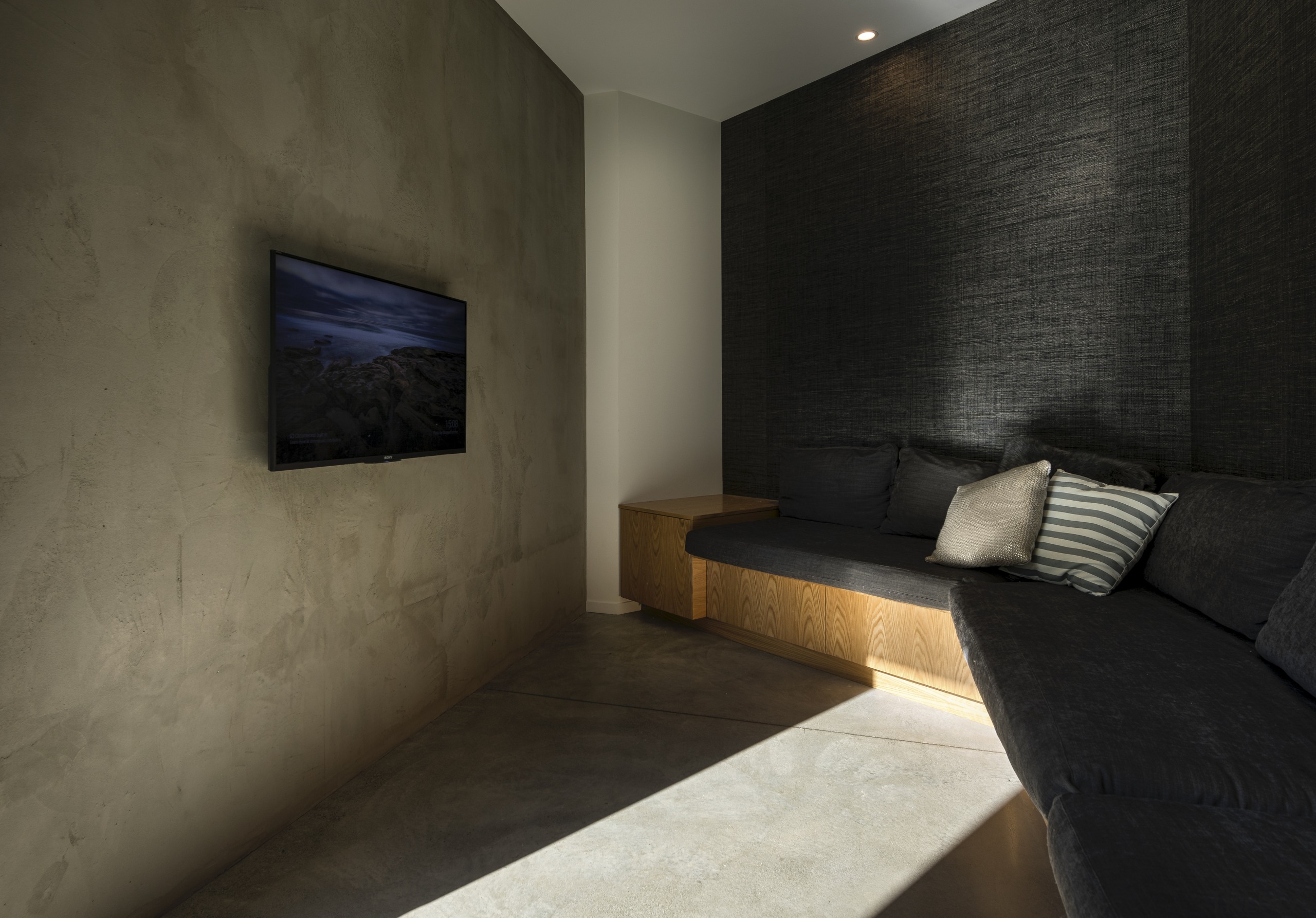 Strong materials meet simple forms in the engaging architecture, bedroom, boutique hotel, building, ceiling, concrete, floor, furniture, house, interior design, property, room, space, suite, tile, wall, black