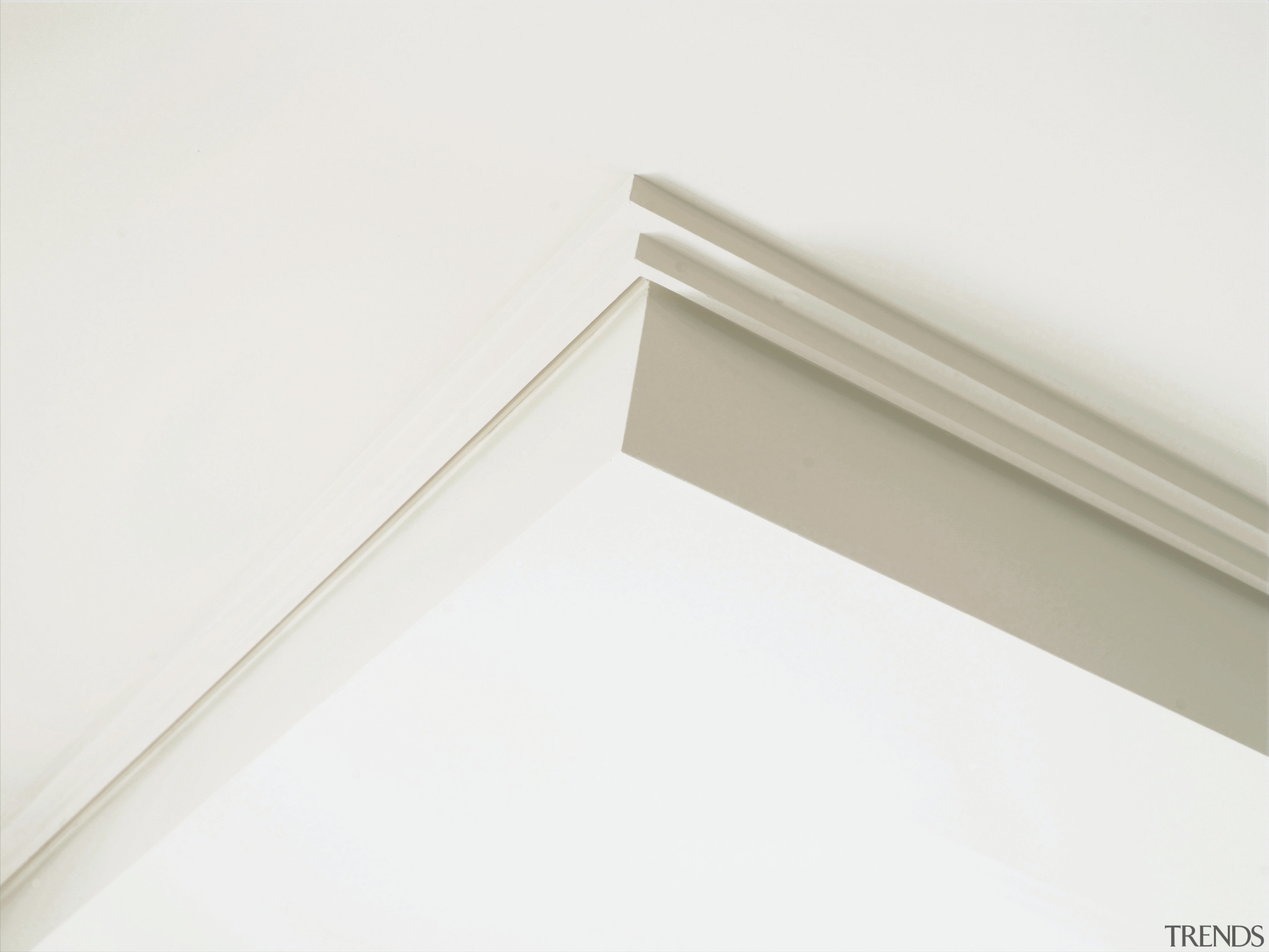 Closeup of ceiling feature showing cornier finishes on angle, line, material, molding, product design, wood, white