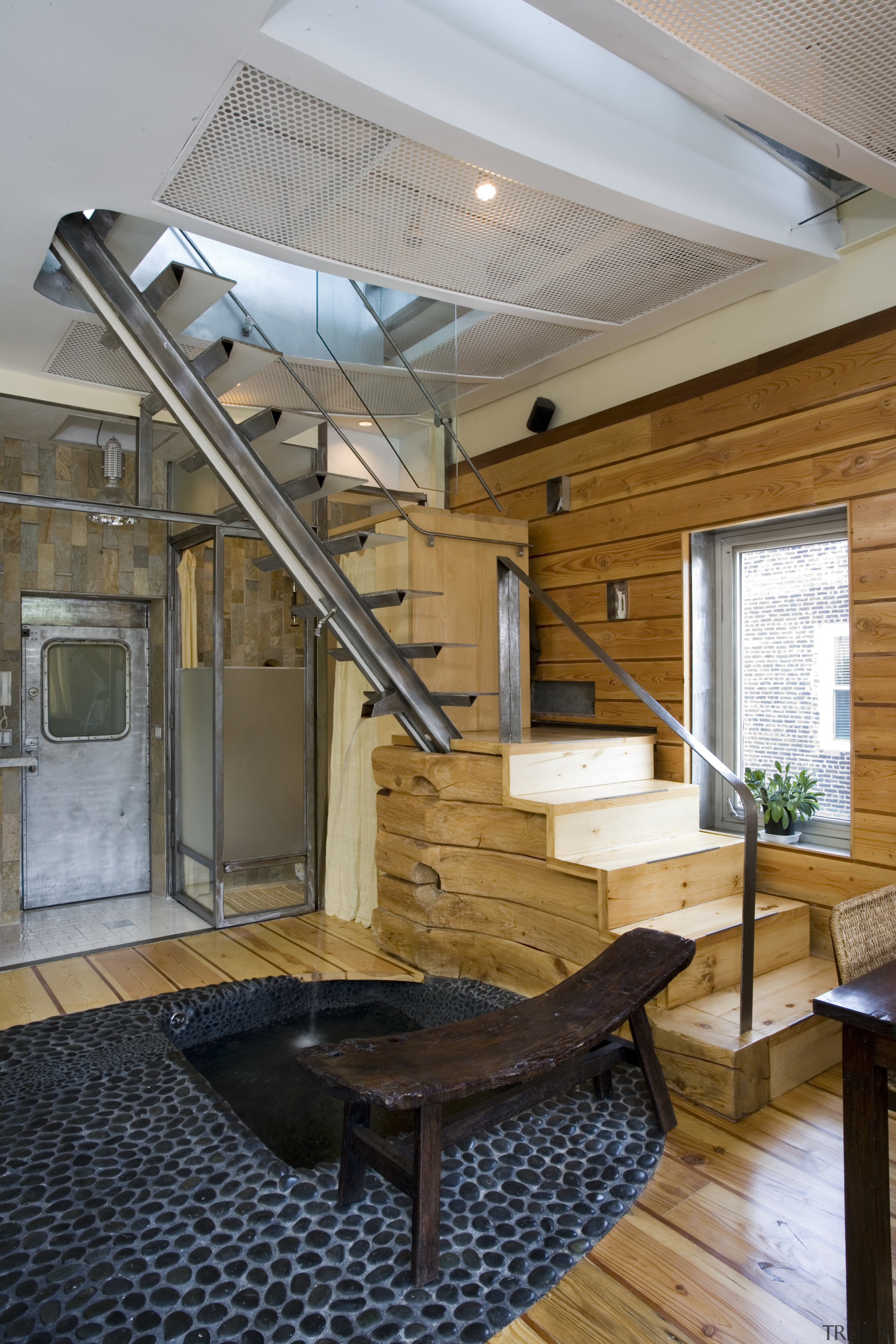 An interior view of the living area feauting architecture, ceiling, daylighting, house, interior design, roof, wood, gray